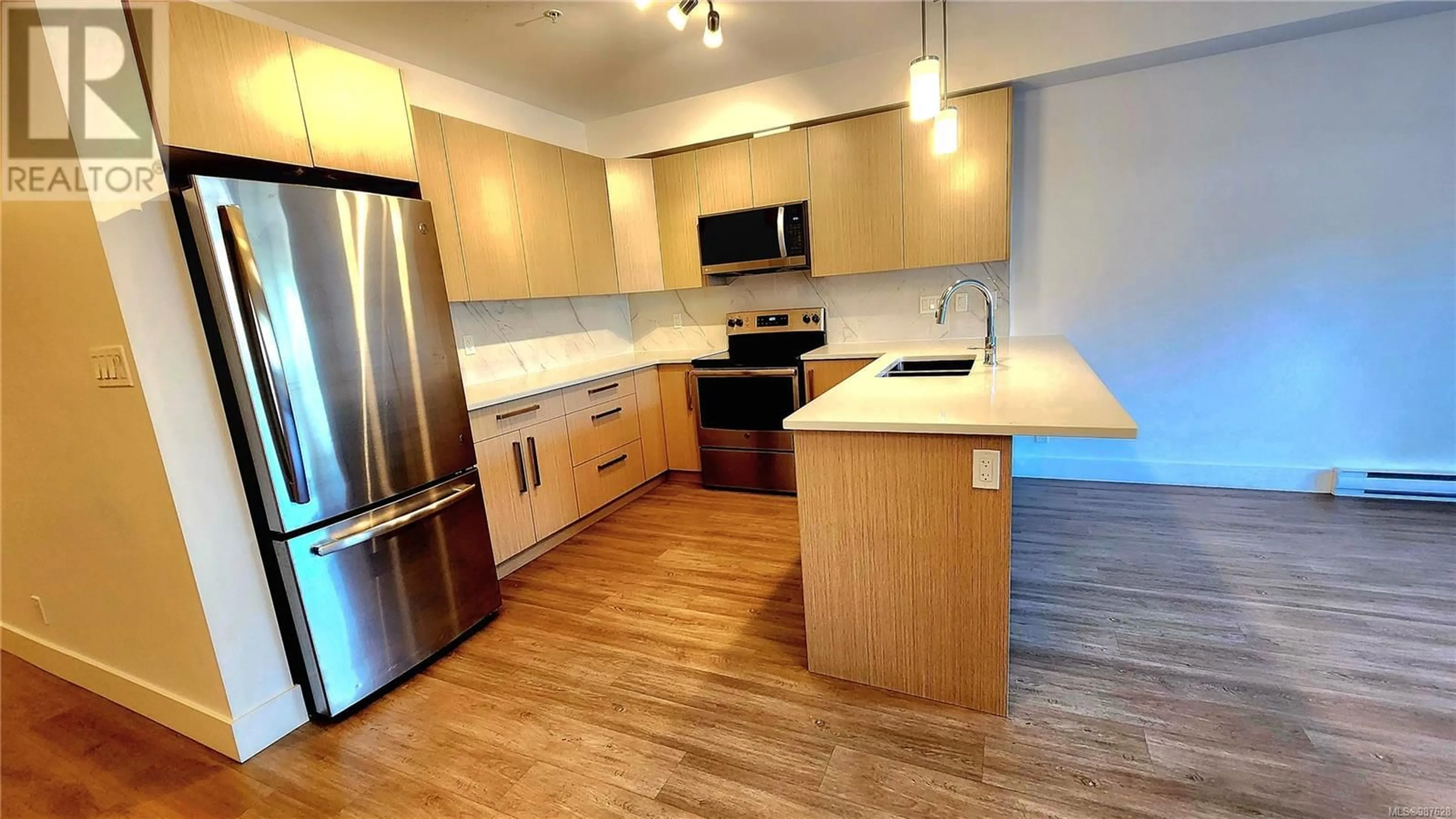 Open concept kitchen, wood/laminate floor for 110 3070 Kilpatrick Ave, Courtenay British Columbia V9N0G7