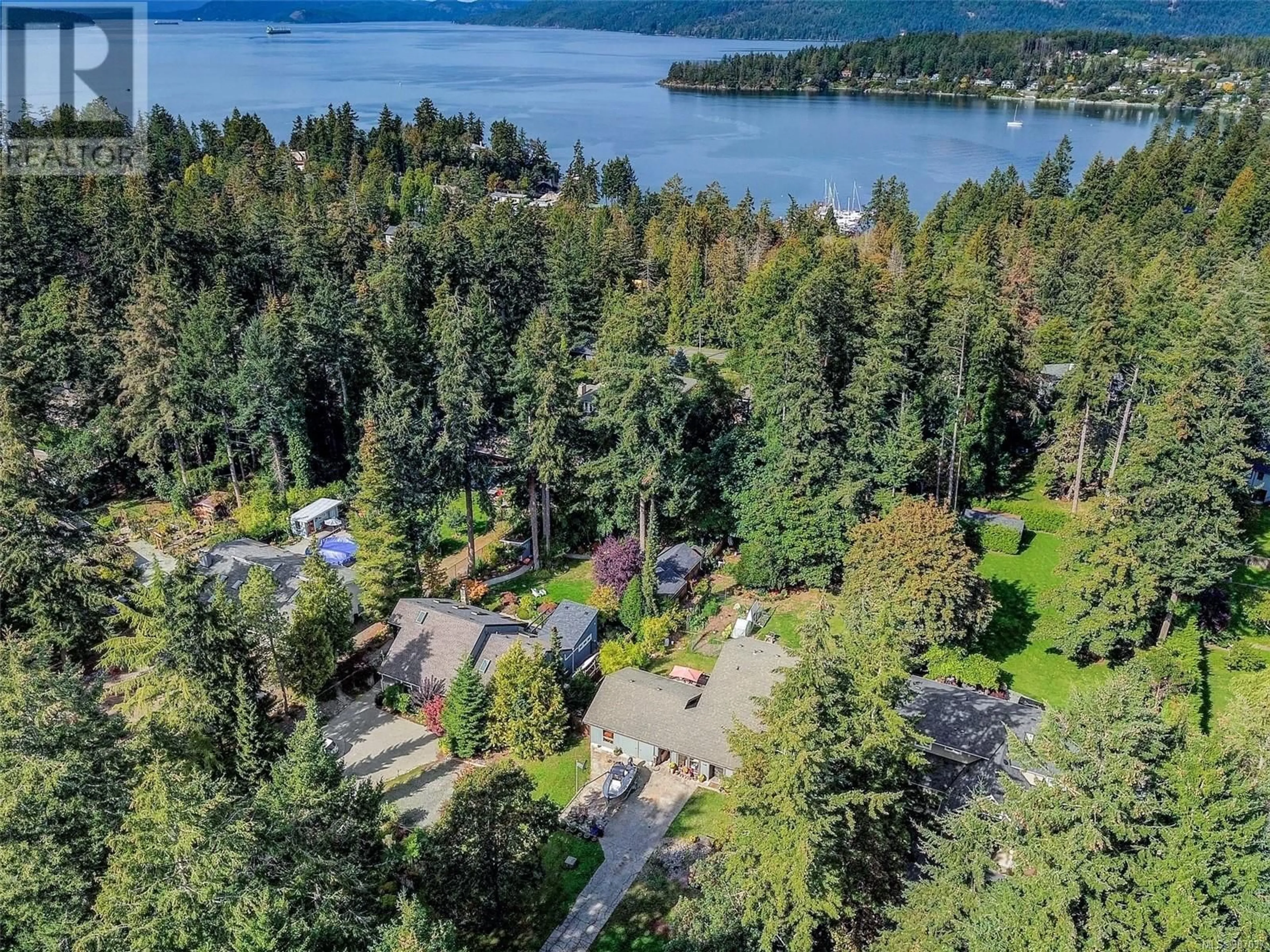 A pic from outside/outdoor area/front of a property/back of a property/a pic from drone, water/lake/river/ocean view for 548 Cromar Rd, North Saanich British Columbia V8L5M5