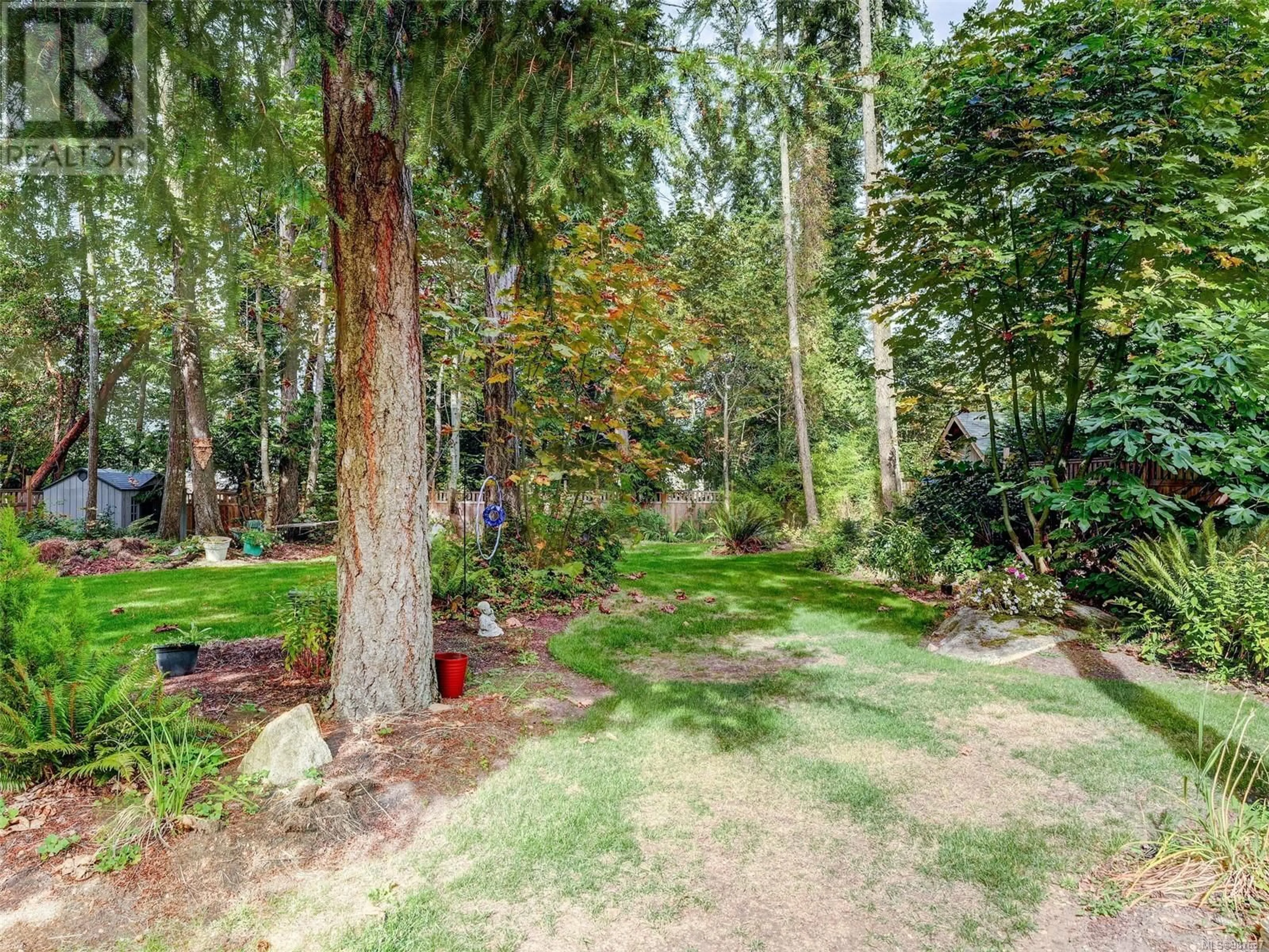 A pic from outside/outdoor area/front of a property/back of a property/a pic from drone, forest/trees view for 548 Cromar Rd, North Saanich British Columbia V8L5M5