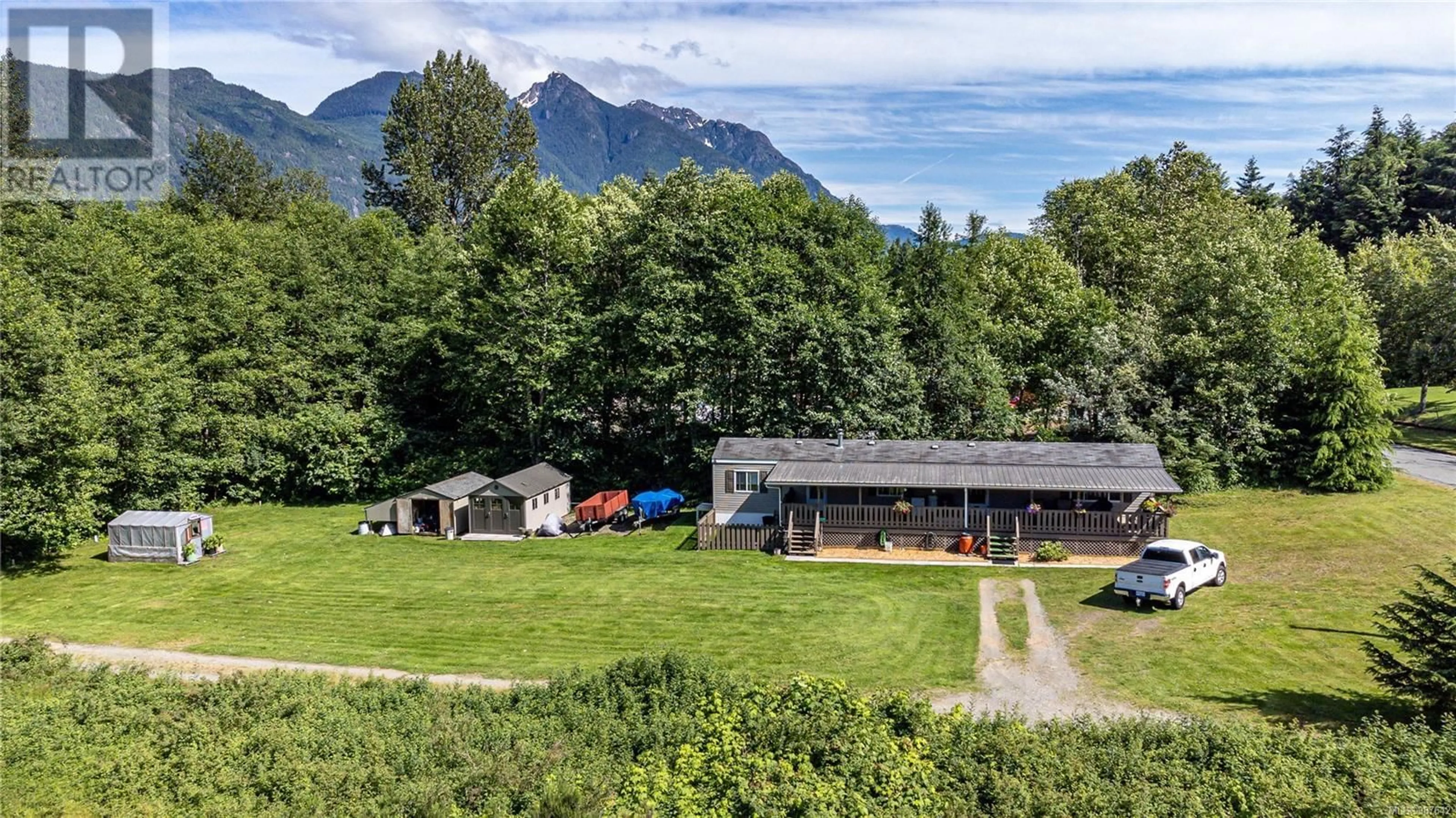 A pic from outside/outdoor area/front of a property/back of a property/a pic from drone, mountain view for 701 Kelsey Way, Sayward British Columbia V0P1R0