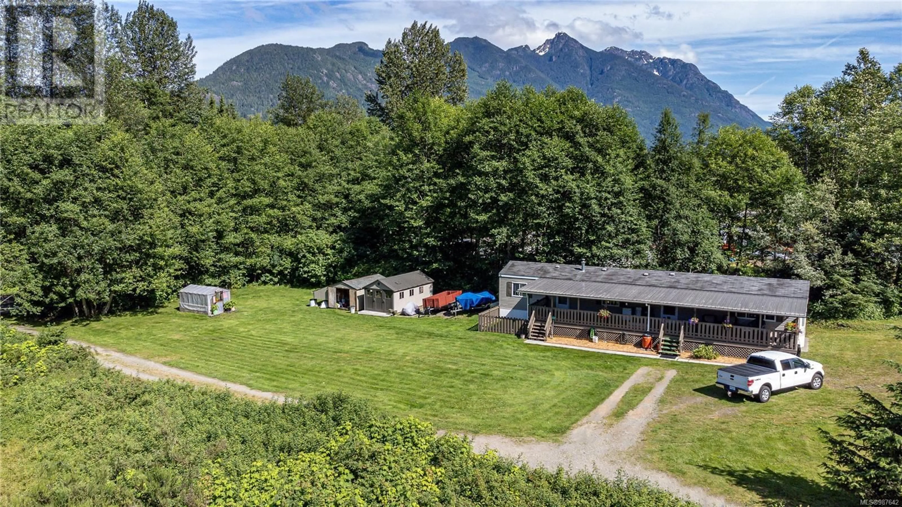 A pic from outside/outdoor area/front of a property/back of a property/a pic from drone, mountain view for 701 Kelsey Way, Sayward British Columbia V0P1R0