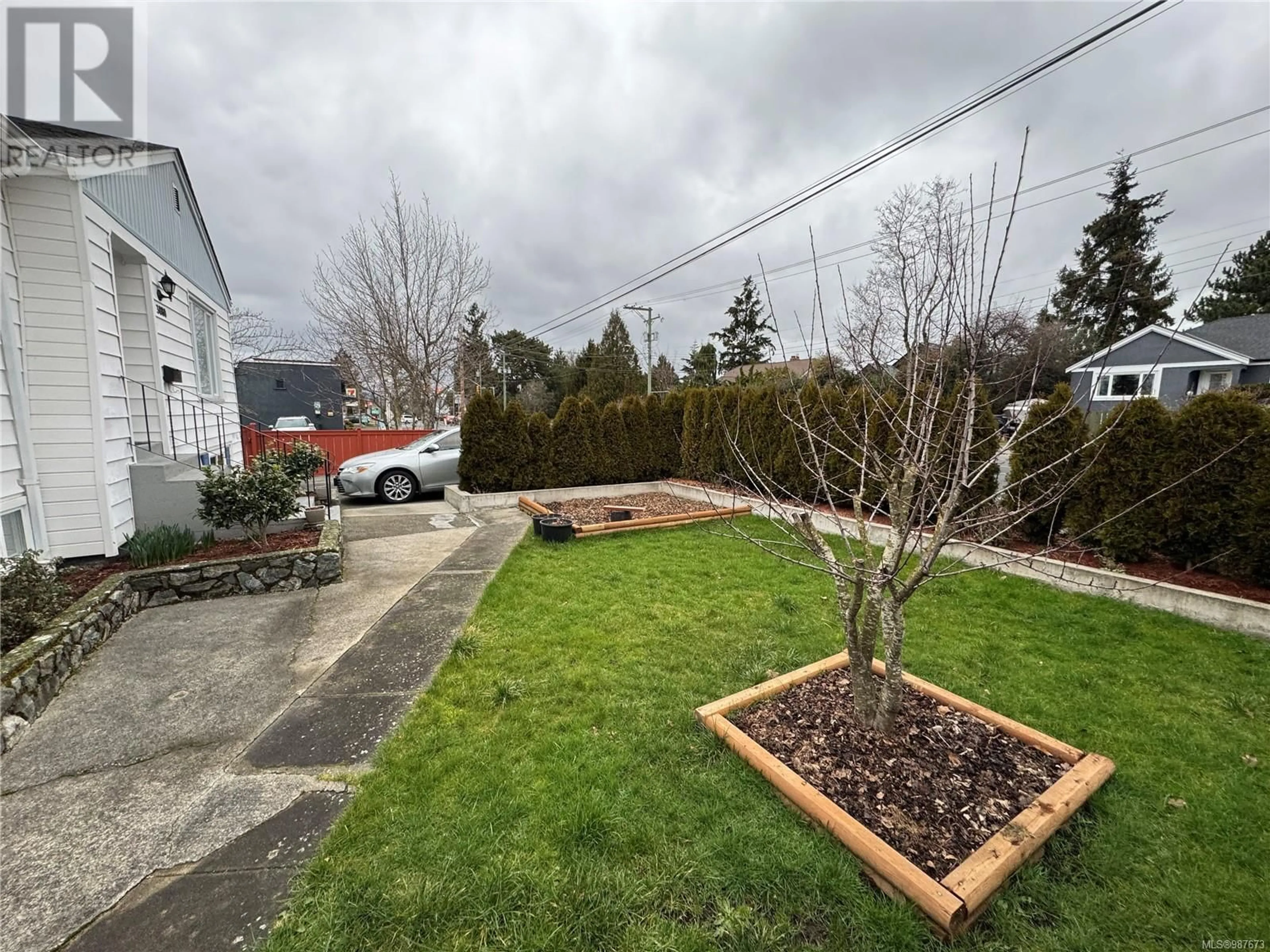 A pic from outside/outdoor area/front of a property/back of a property/a pic from drone, street for 3880 Carey Rd, Saanich British Columbia V8Z4C9