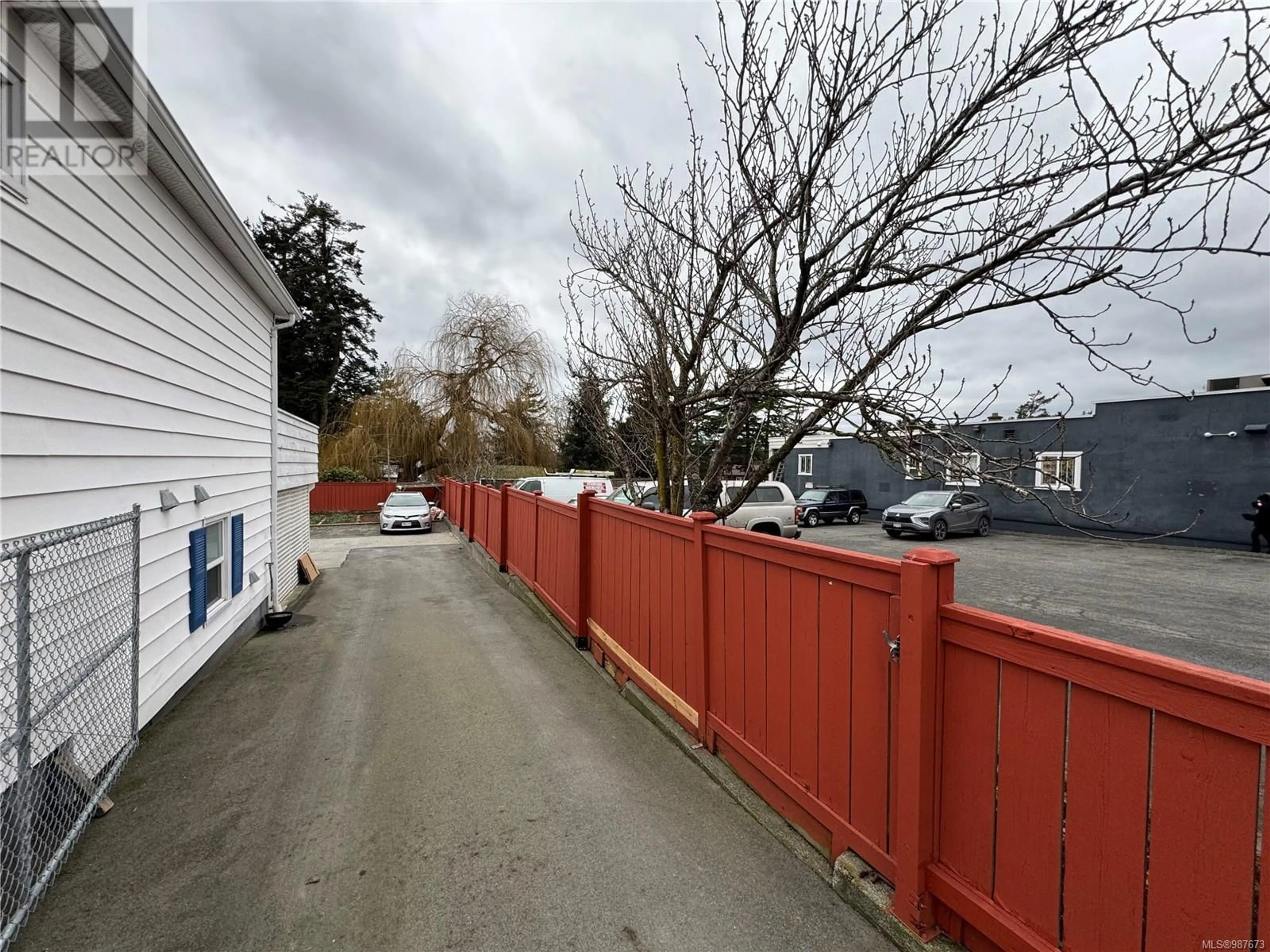 A pic from outside/outdoor area/front of a property/back of a property/a pic from drone, street for 3880 Carey Rd, Saanich British Columbia V8Z4C9