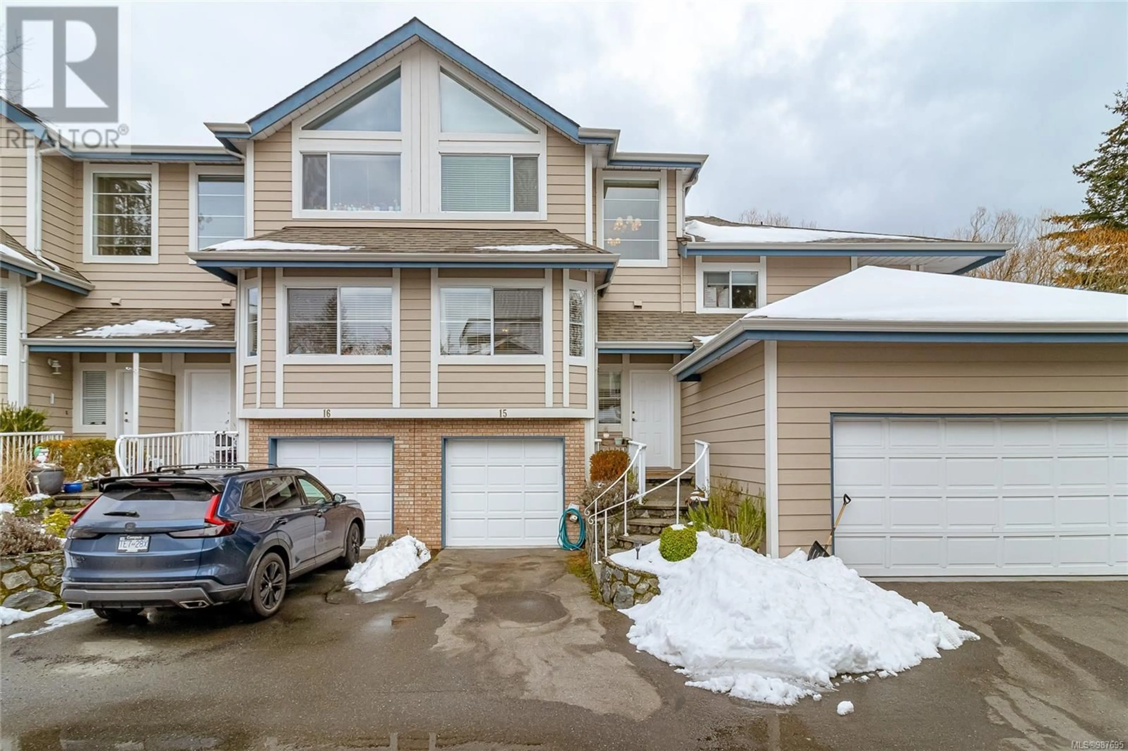 A pic from outside/outdoor area/front of a property/back of a property/a pic from drone, street for 15 - 4619 ELK LAKE DRIVE, Saanich British Columbia V8Z5M2