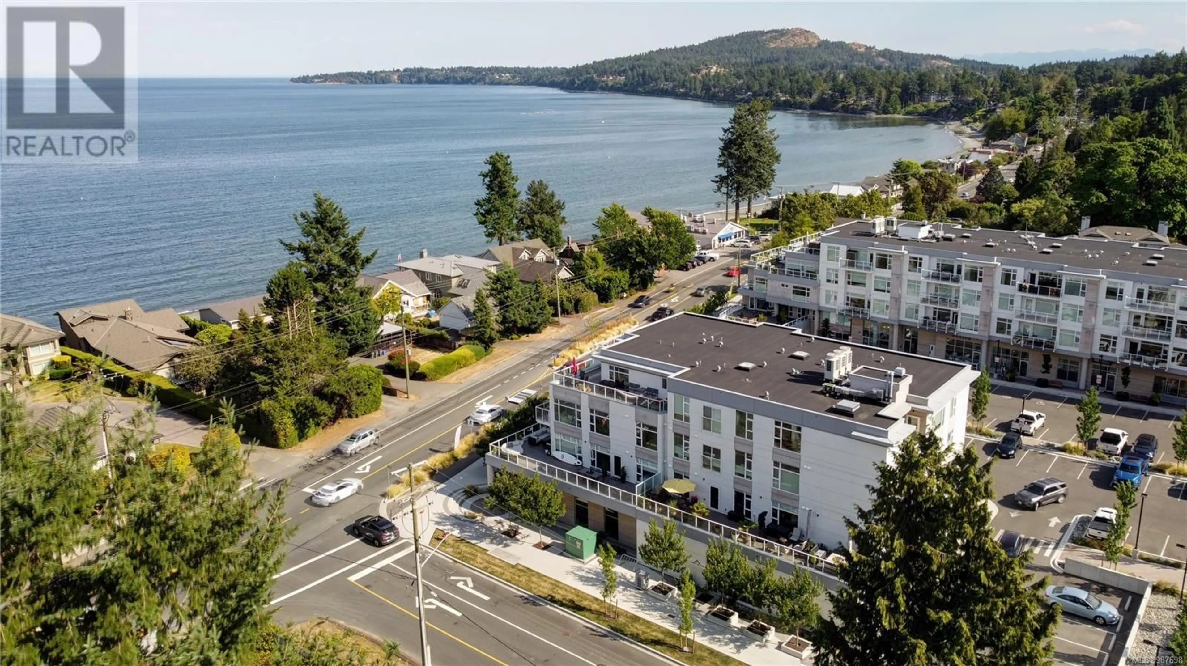 A pic from outside/outdoor area/front of a property/back of a property/a pic from drone, water/lake/river/ocean view for 404 5120 Cordova Bay Rd, Saanich British Columbia V8Y2K5