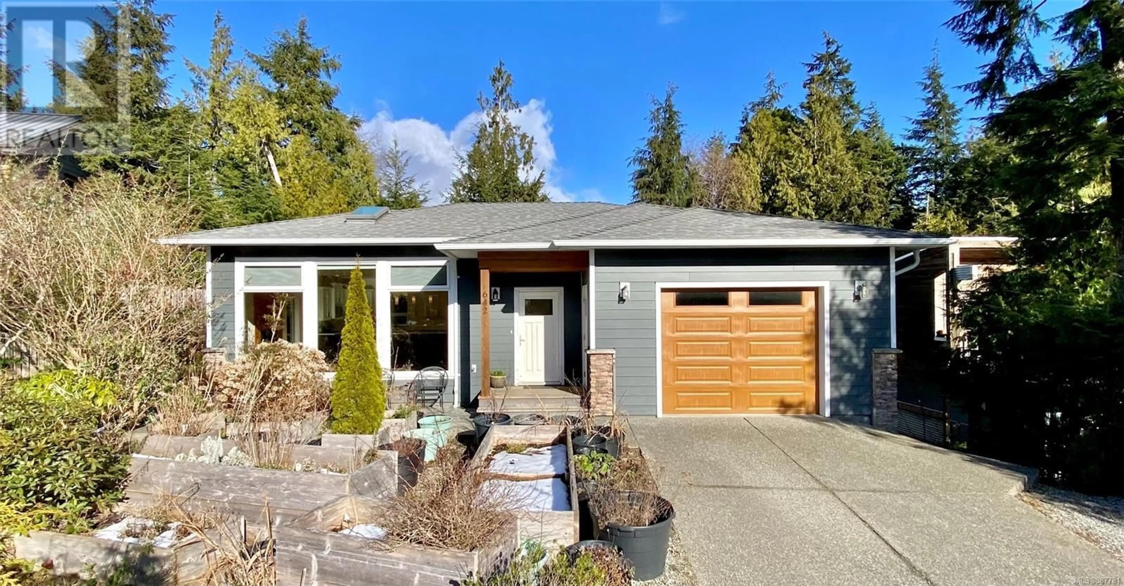 Home with vinyl exterior material, street for 642 Yew Wood Rd, Tofino British Columbia V0R2Z0