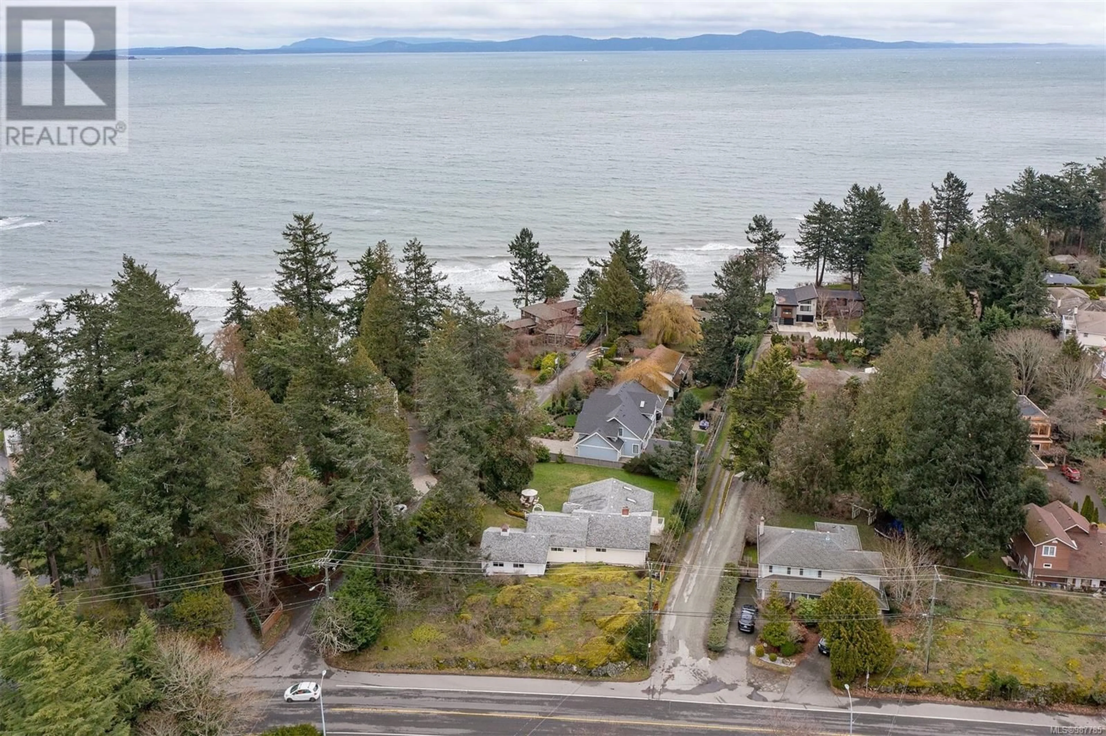 A pic from outside/outdoor area/front of a property/back of a property/a pic from drone, water/lake/river/ocean view for 1101 Darcy Lane, Saanich British Columbia V8Y1G1