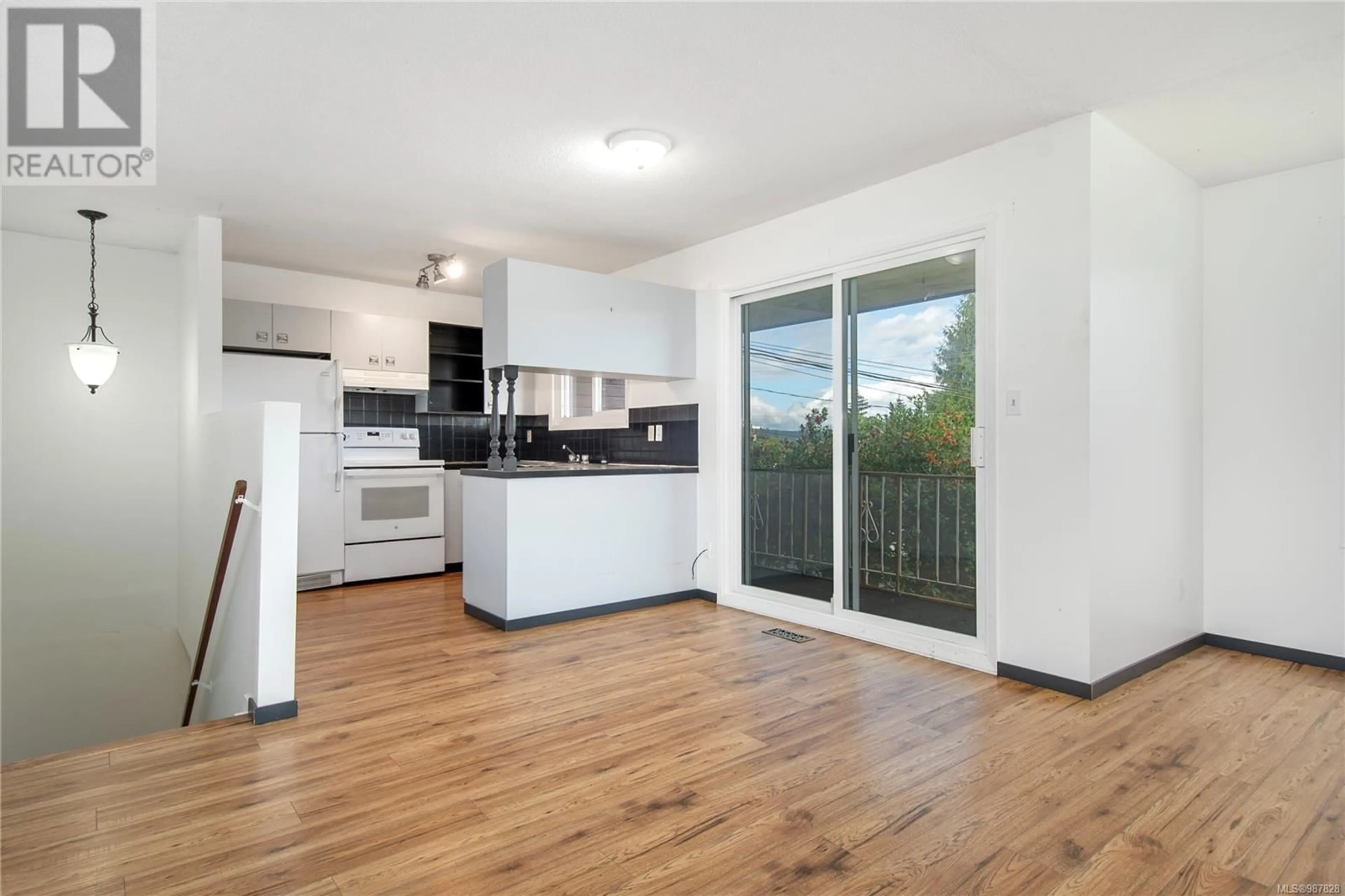 Open concept kitchen, wood/laminate floor for 1869 CHEVIOT ROAD, Campbell River British Columbia V9W4E2