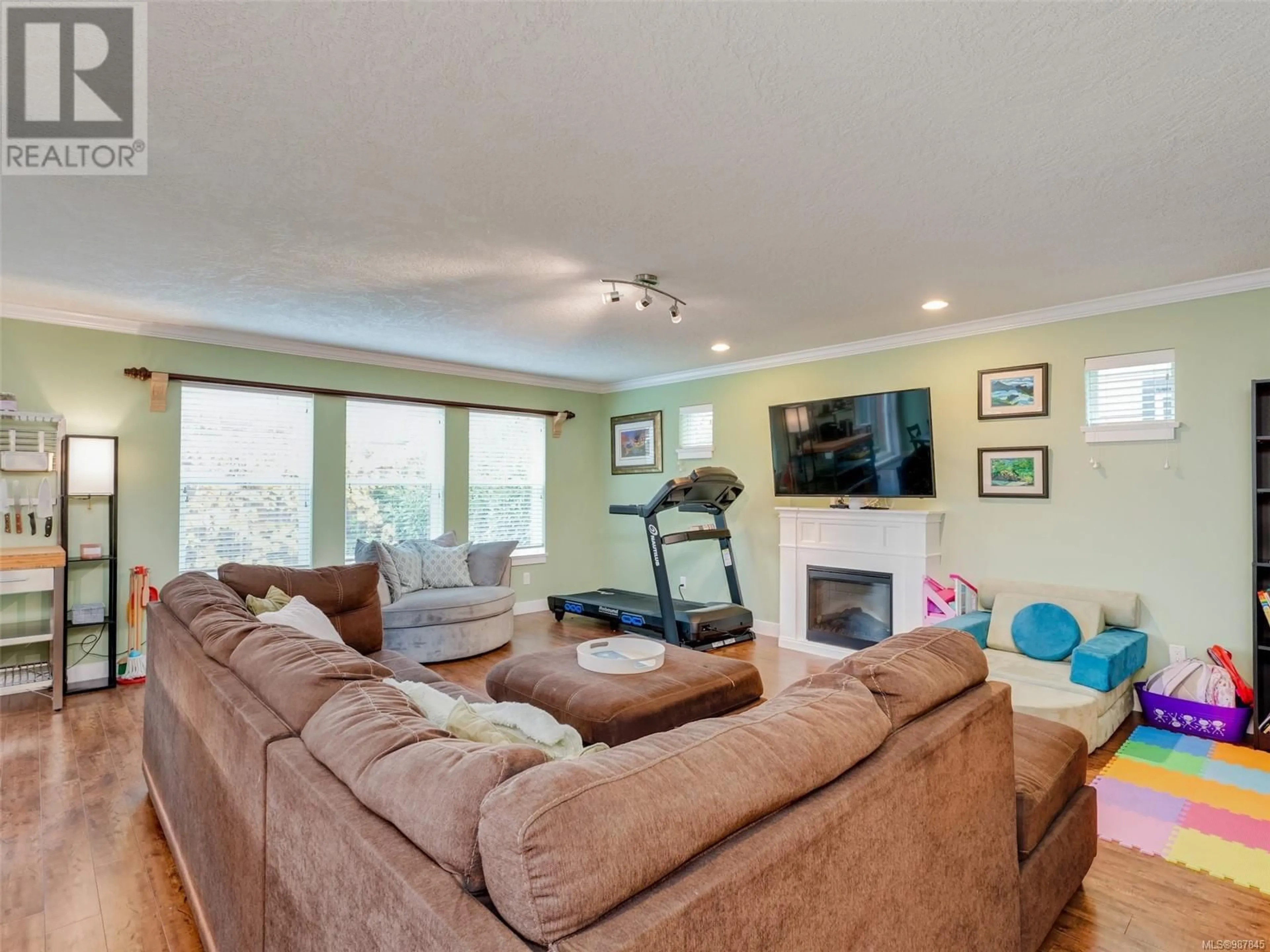 Living room with furniture, wood/laminate floor for 3314 Hazelwood Rd, Langford British Columbia V9C0H3