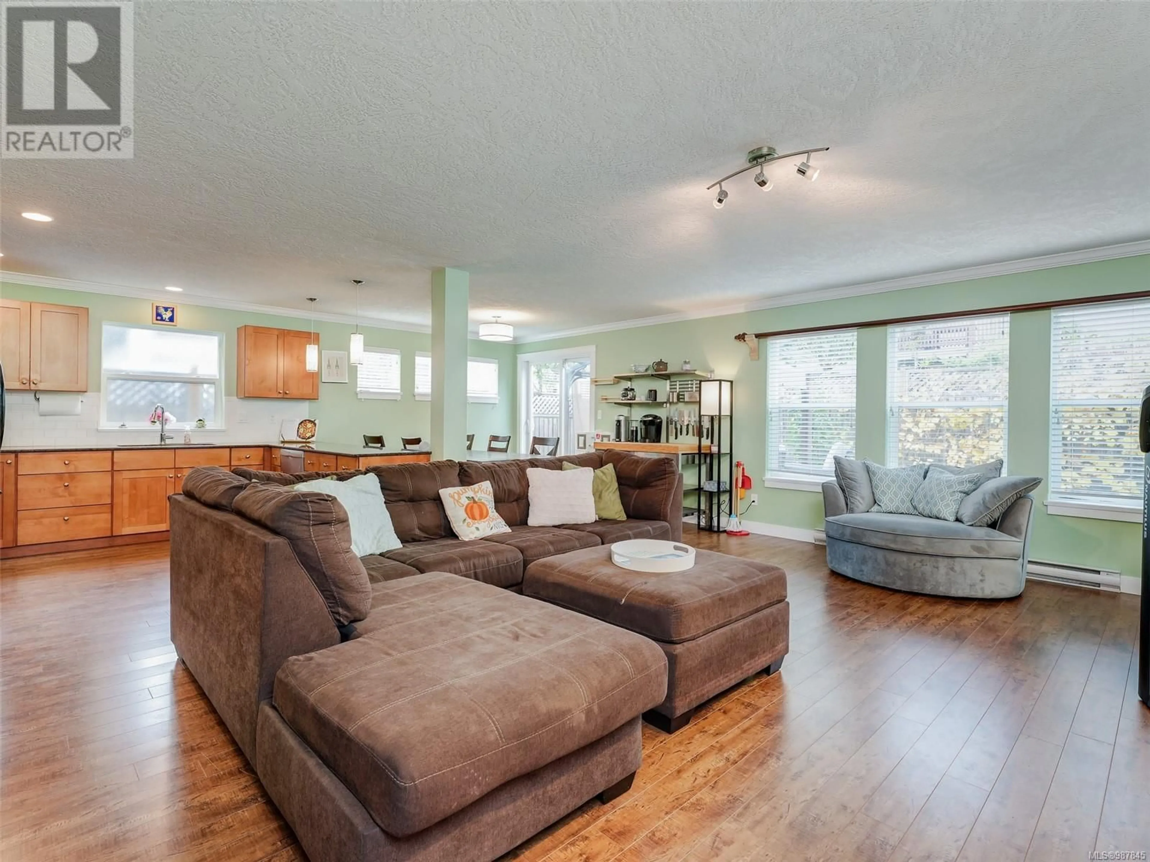 Living room with furniture, wood/laminate floor for 3314 Hazelwood Rd, Langford British Columbia V9C0H3