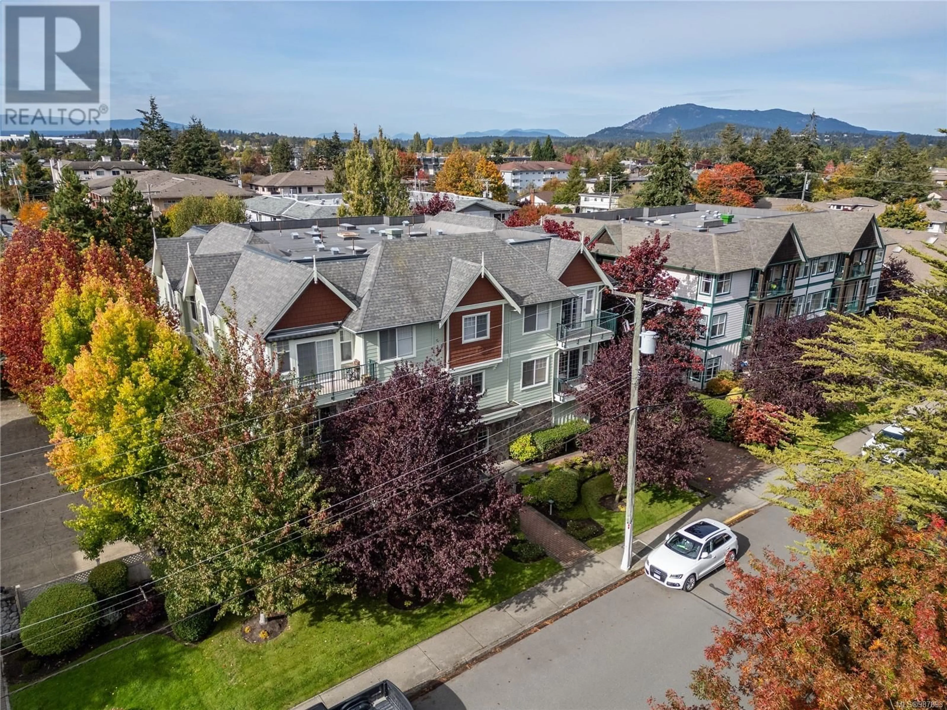 A pic from outside/outdoor area/front of a property/back of a property/a pic from drone, mountain view for 203 9950 Fourth St, Sidney British Columbia V8L2Z7