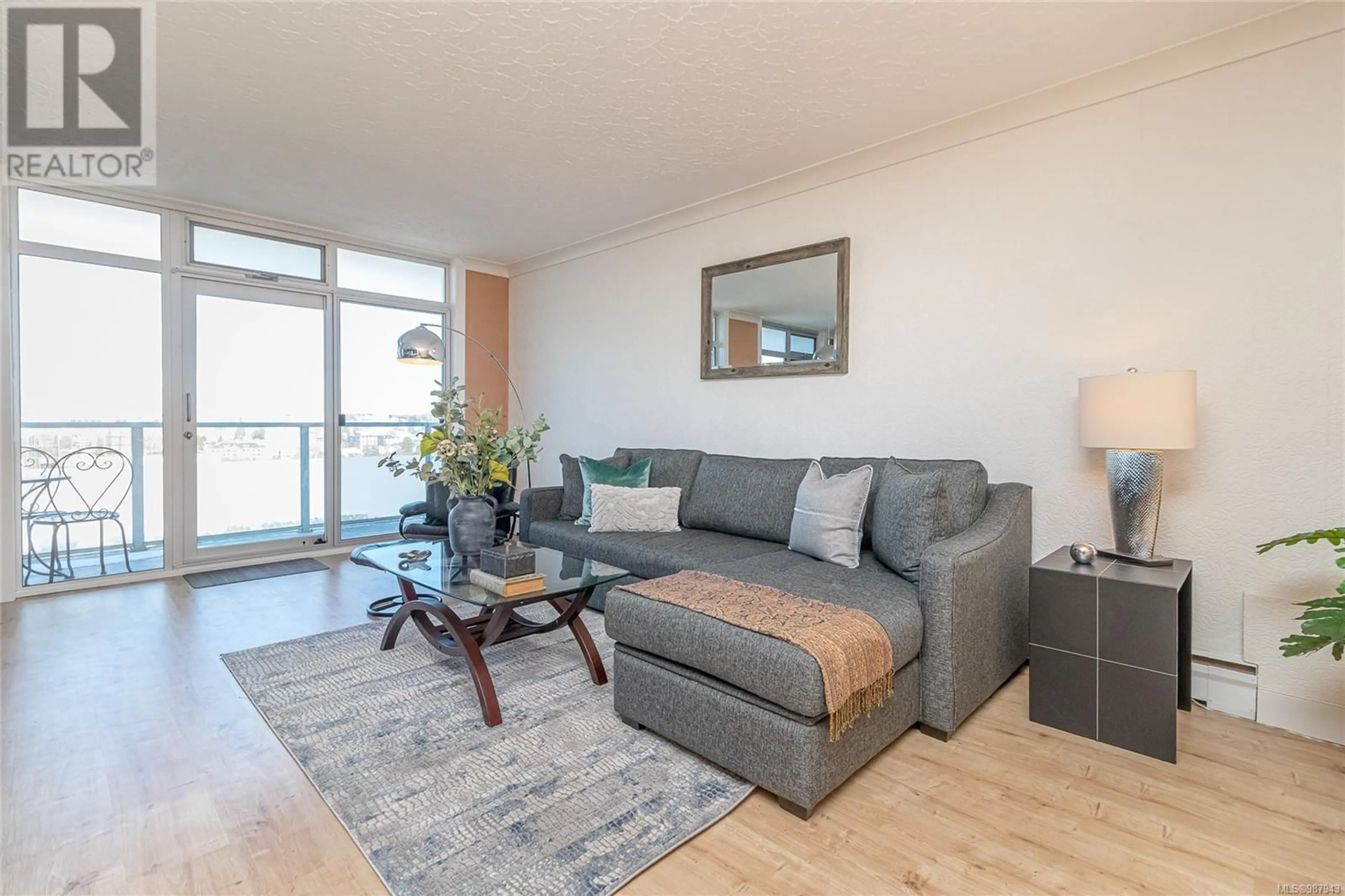 Living room with furniture, wood/laminate floor for 1201 250 Douglas St, Victoria British Columbia V8V2P4