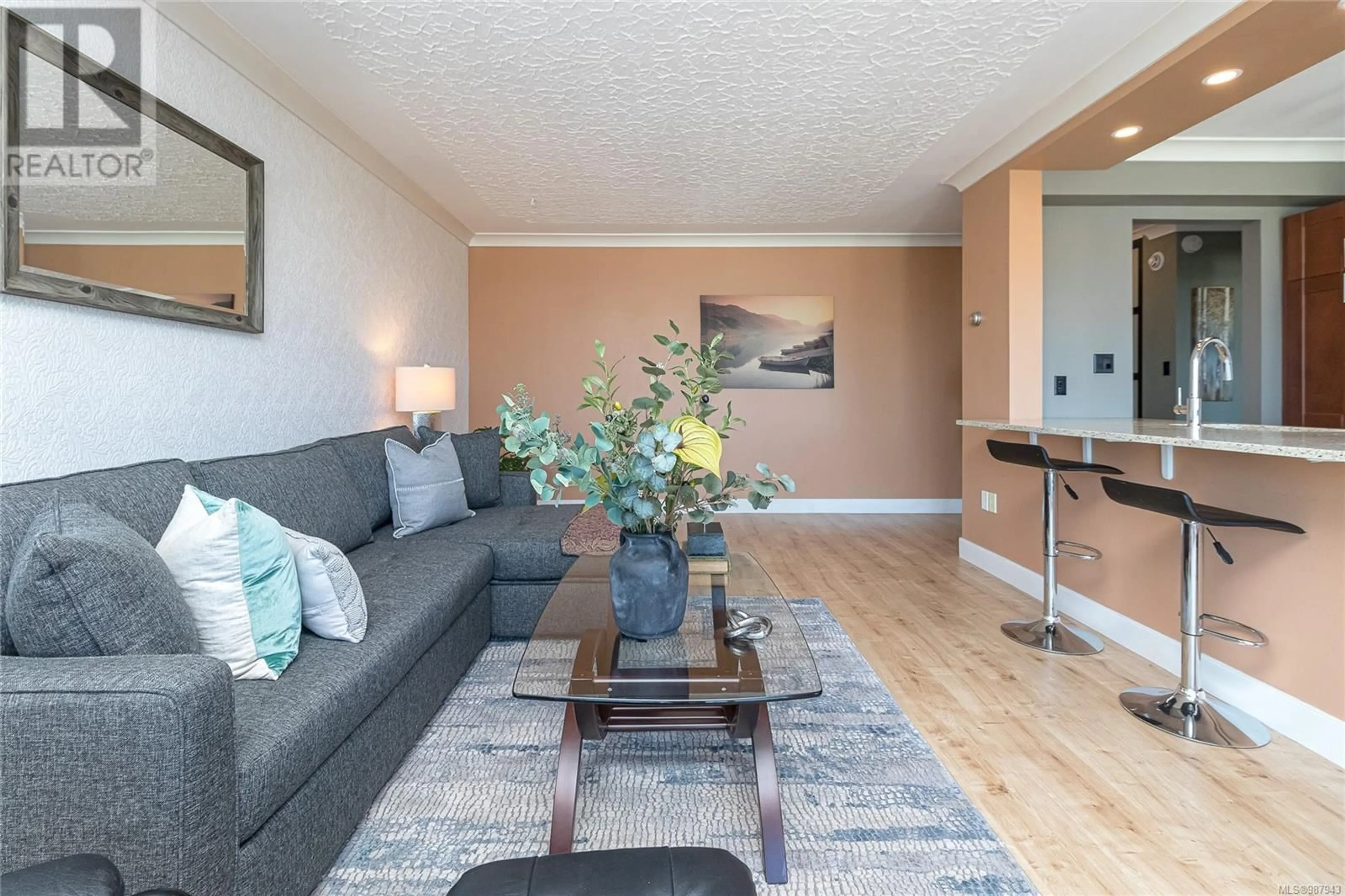 Living room with furniture, wood/laminate floor for 1201 250 Douglas St, Victoria British Columbia V8V2P4