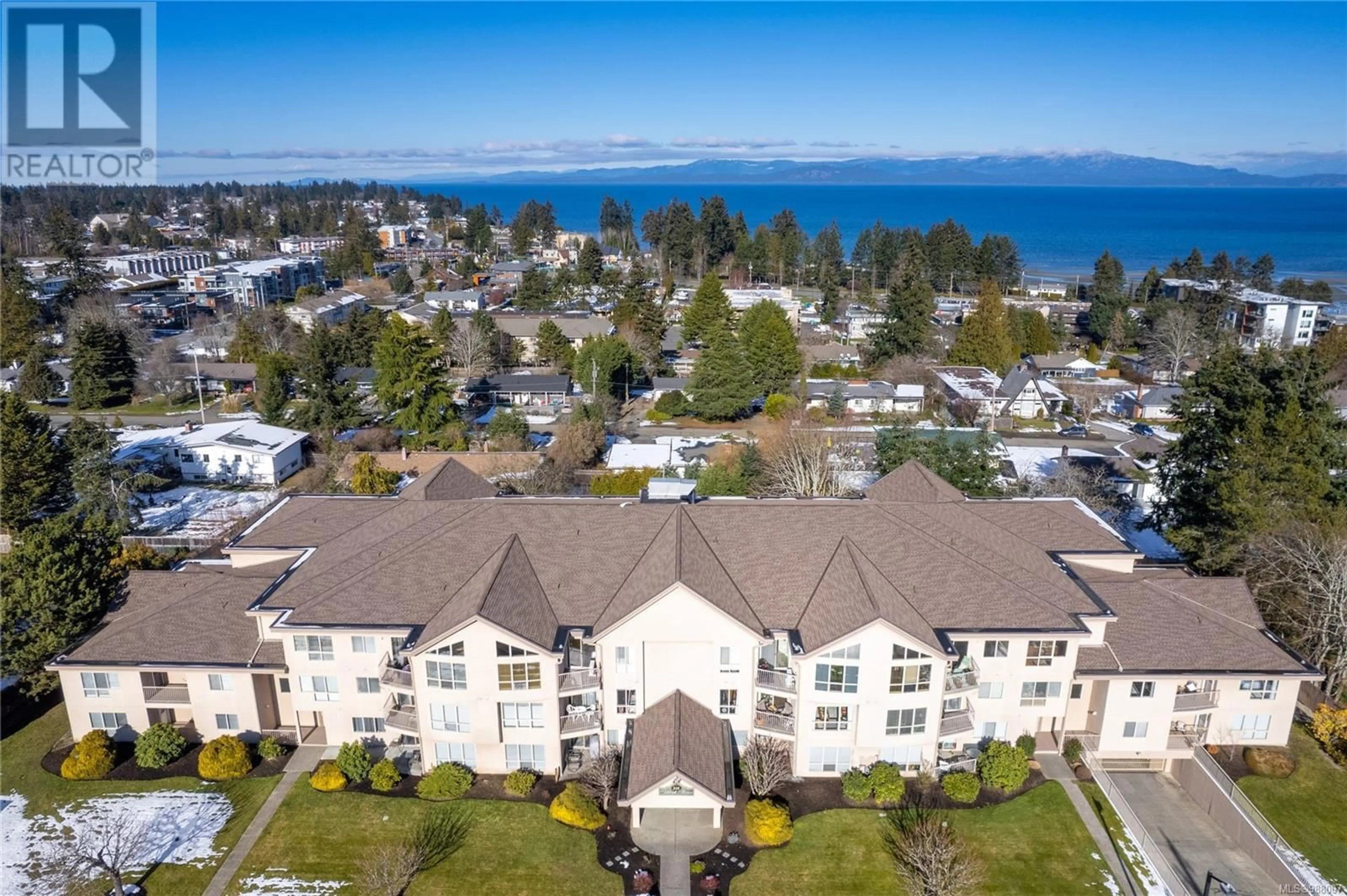 A pic from outside/outdoor area/front of a property/back of a property/a pic from drone, water/lake/river/ocean view for 209 335 Hirst Ave W, Parksville British Columbia V9P2R5