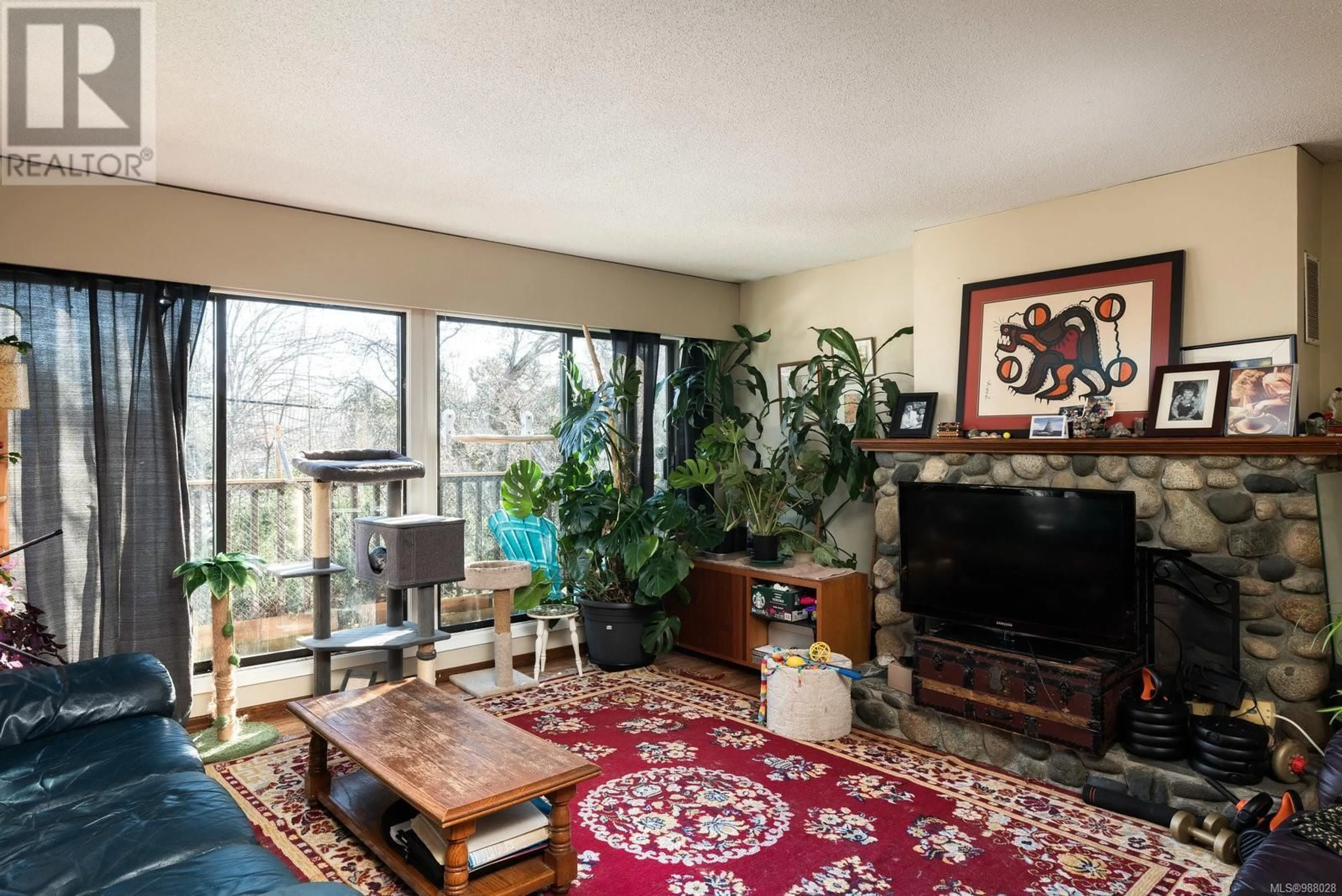 Living room with furniture, unknown for 3954 Bow Rd, Saanich British Columbia V8N3B1