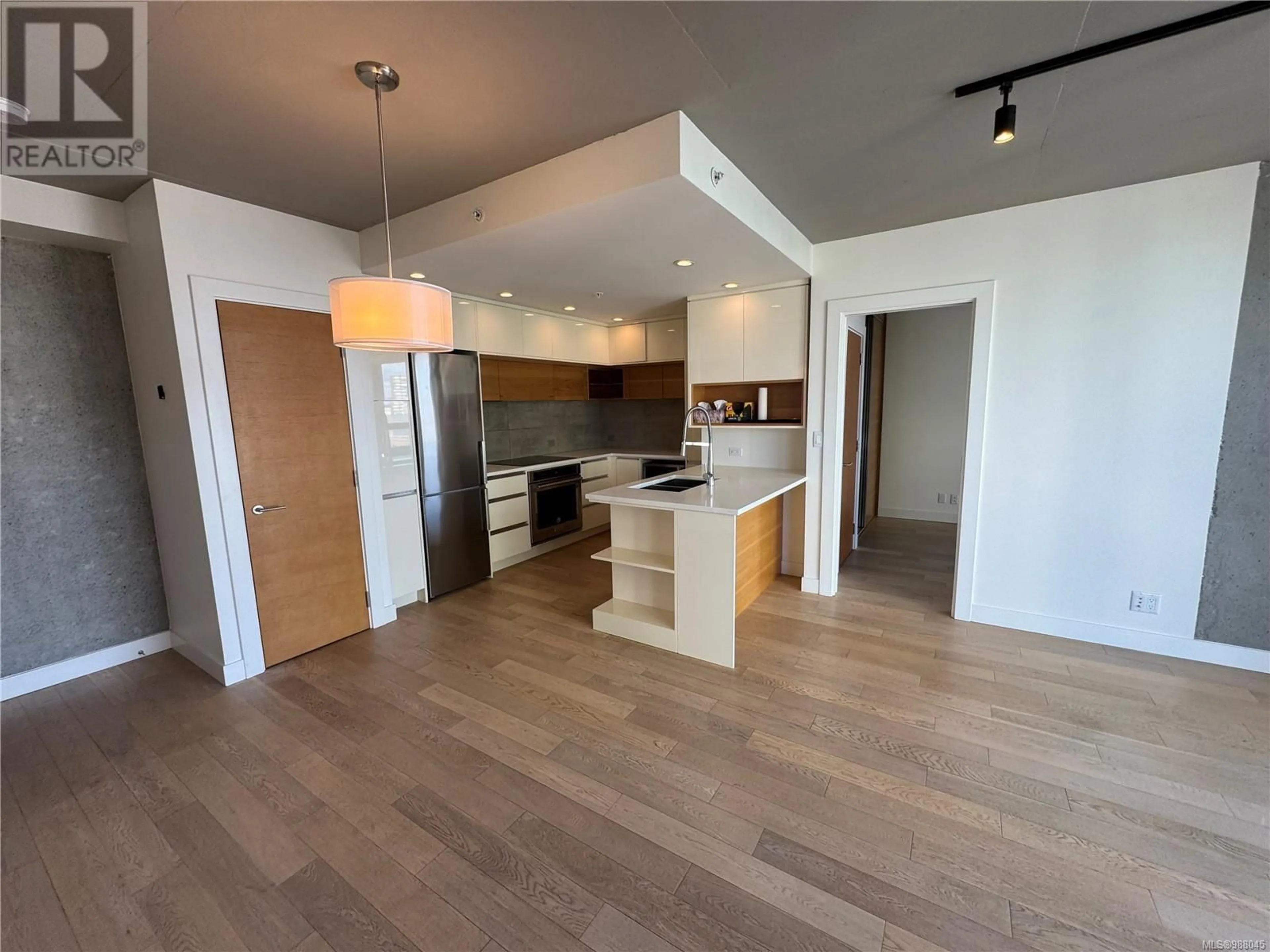 Open concept kitchen, wood/laminate floor for 805 - 989 JOHNSON STREET, Victoria British Columbia V8V0E3