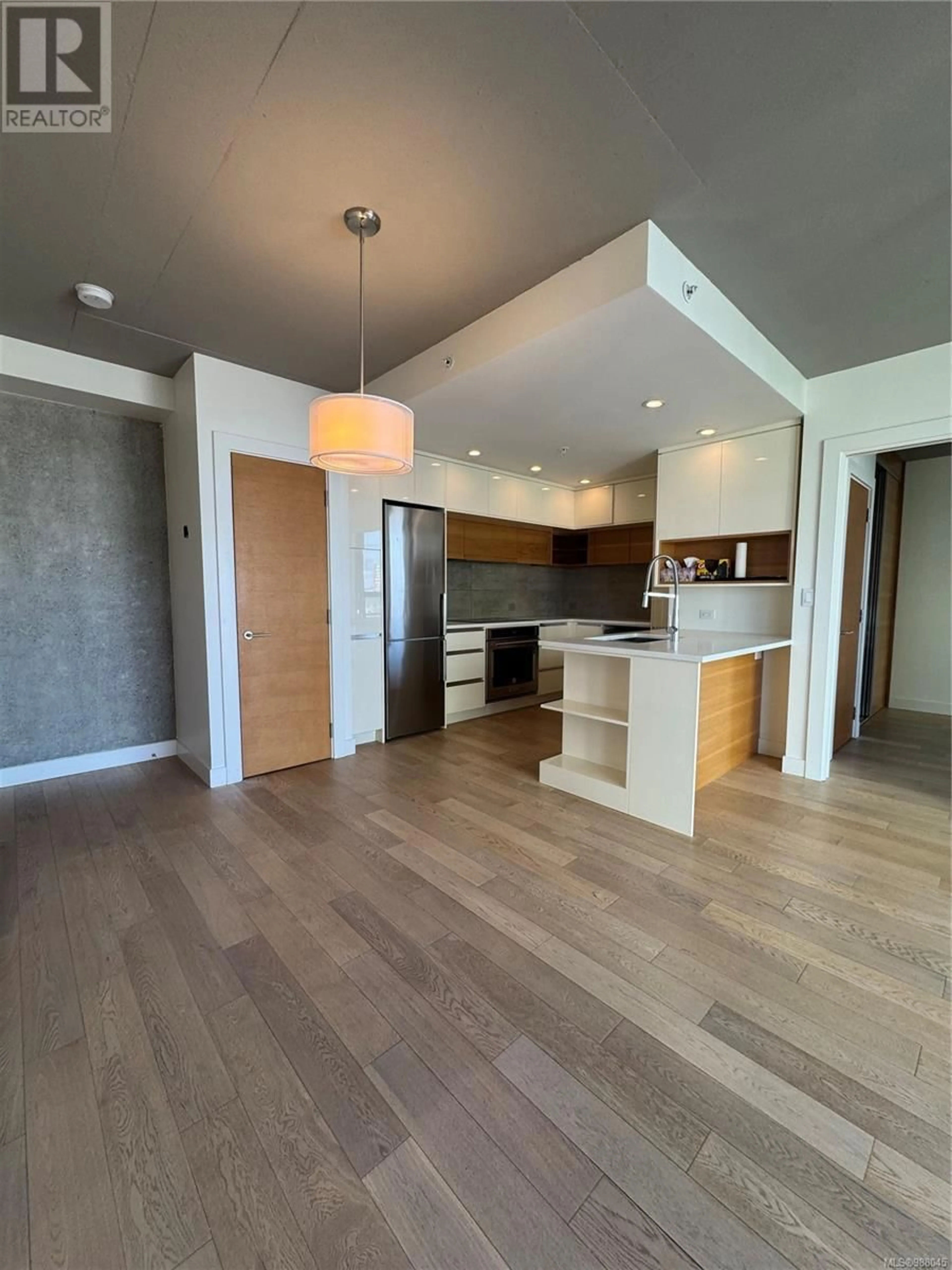 Open concept kitchen, wood/laminate floor for 805 - 989 JOHNSON STREET, Victoria British Columbia V8V0E3