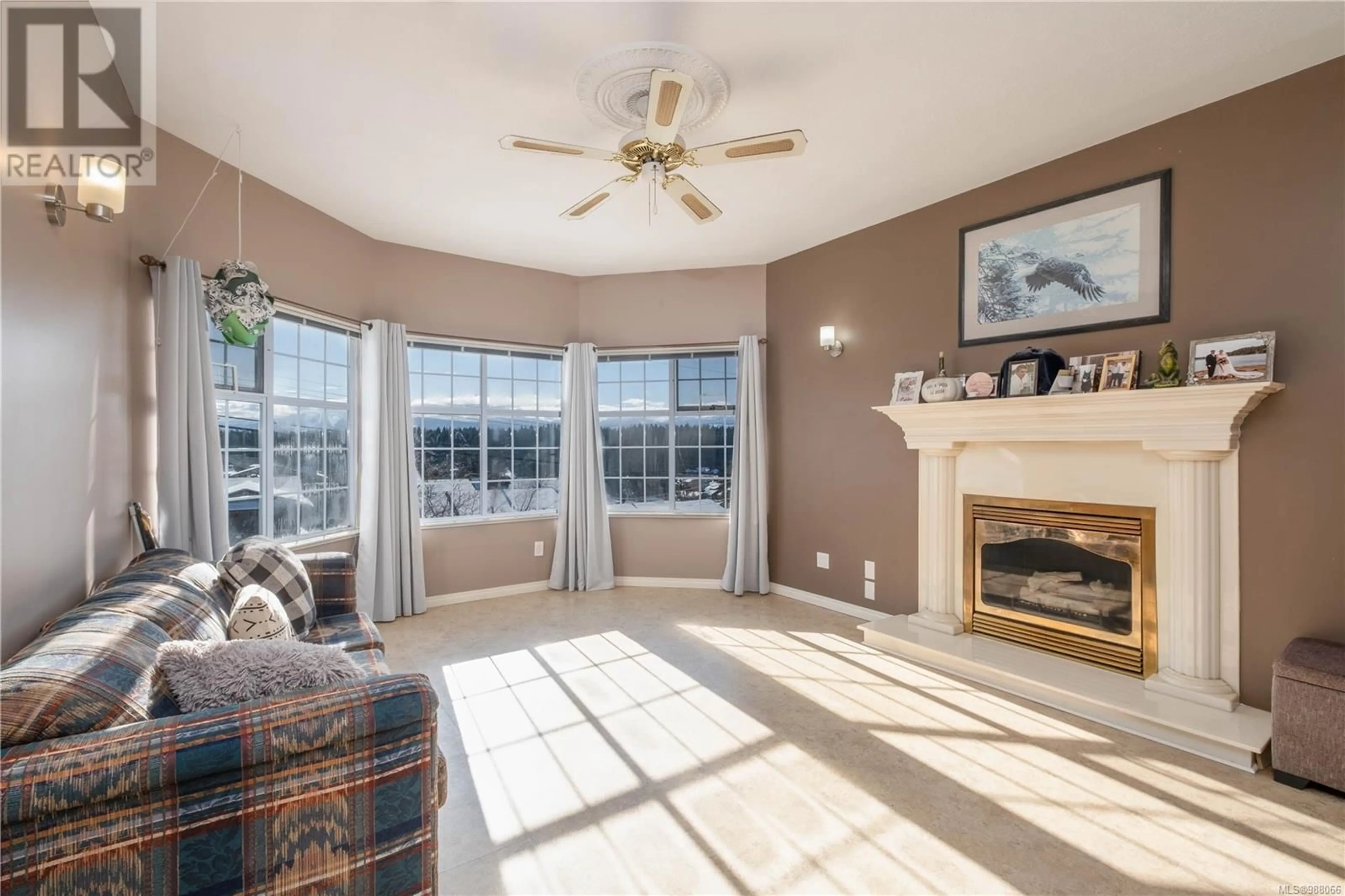 Living room with furniture, ceramic/tile floor for 828 Merecroft Rd, Campbell River British Columbia V9W7J6