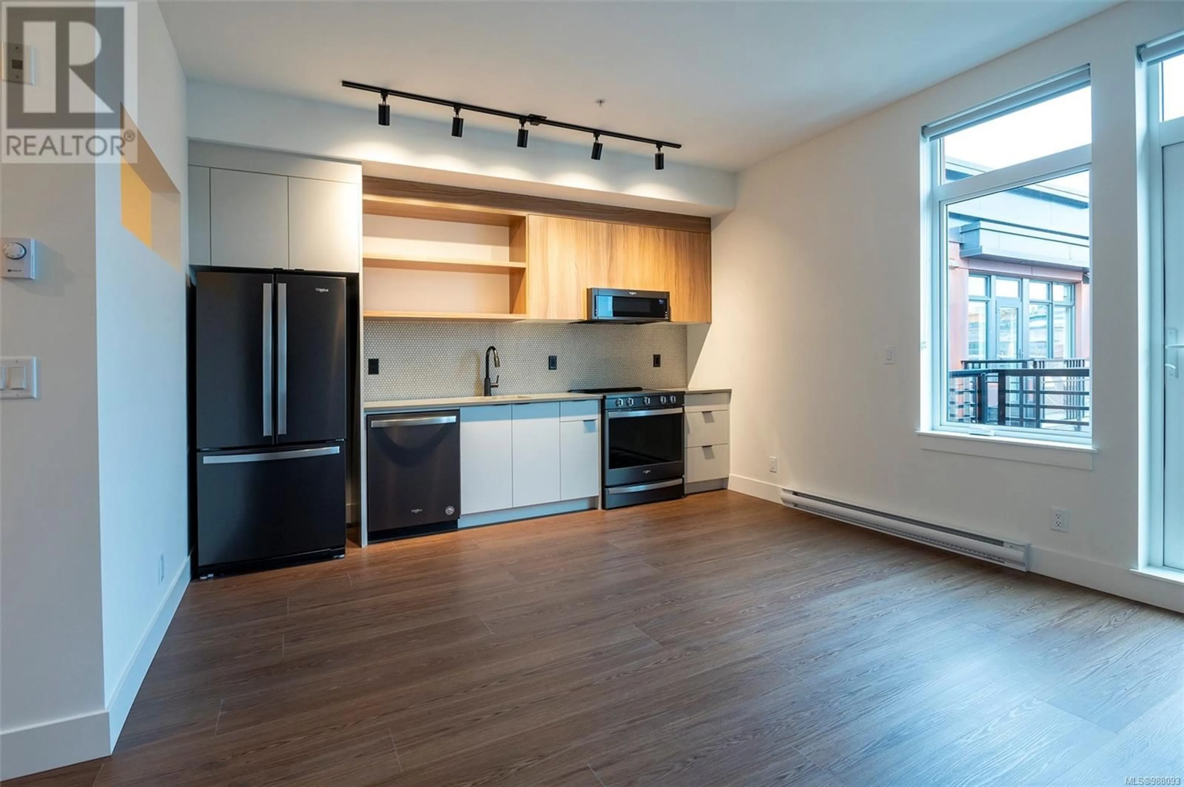 Open concept kitchen, wood/laminate floor for 505 515 Chatham St, Victoria British Columbia V8T0C8