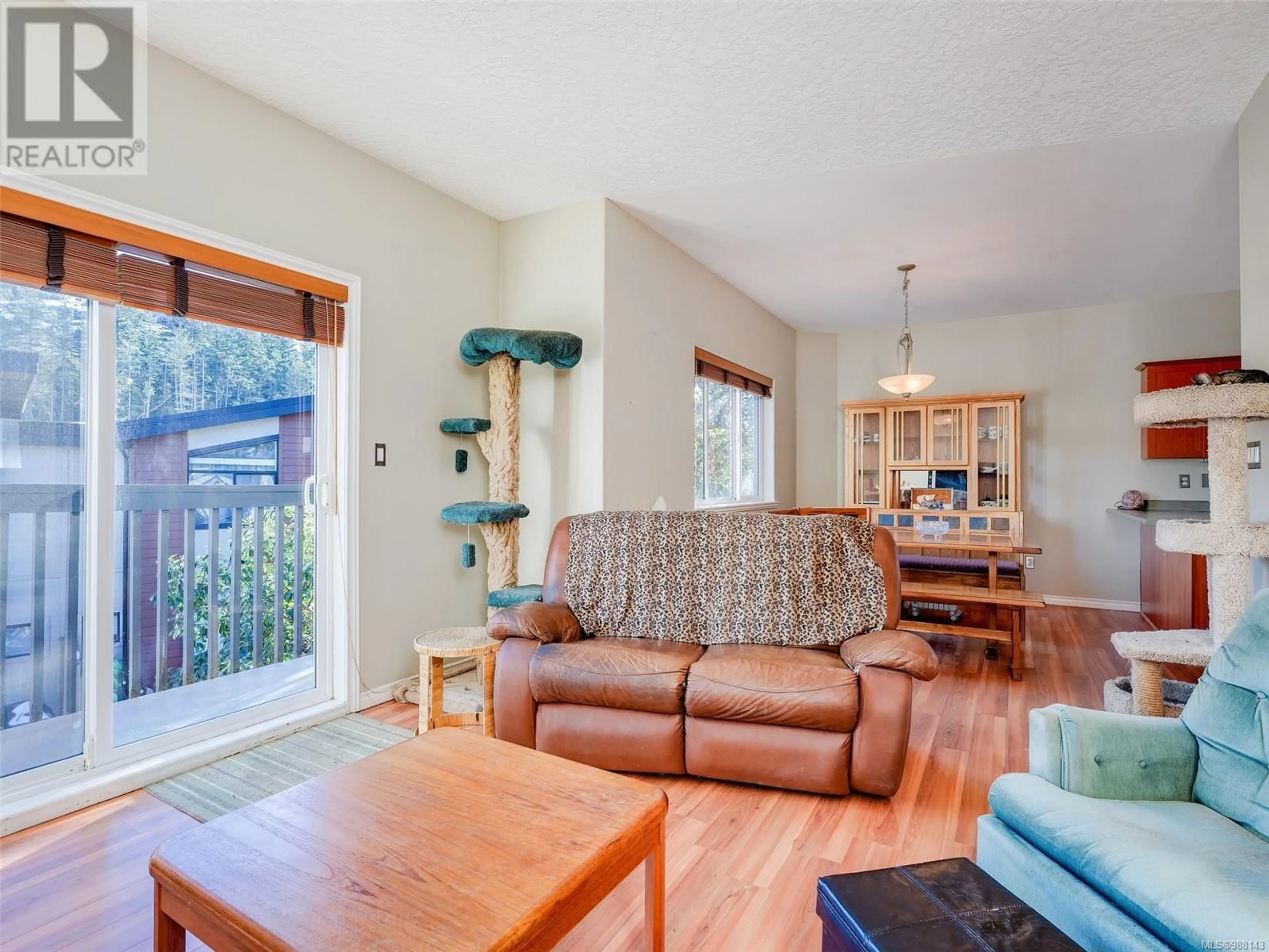 Living room with furniture, wood/laminate floor for 455 Avery Crt, Langford British Columbia V9B6L3