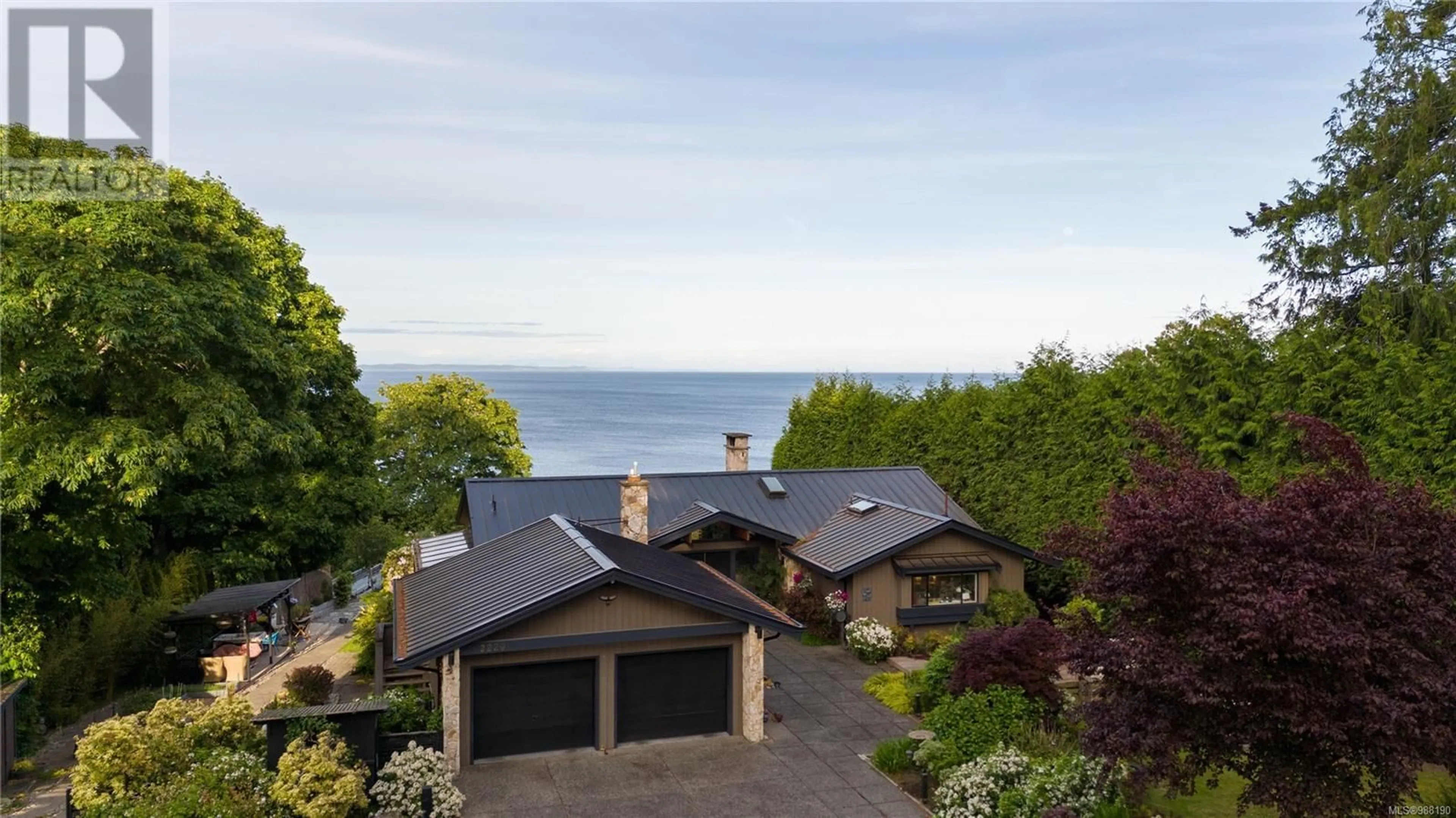 A pic from outside/outdoor area/front of a property/back of a property/a pic from drone, water/lake/river/ocean view for 2220 Arbutus Rd, Saanich British Columbia V8N1V3