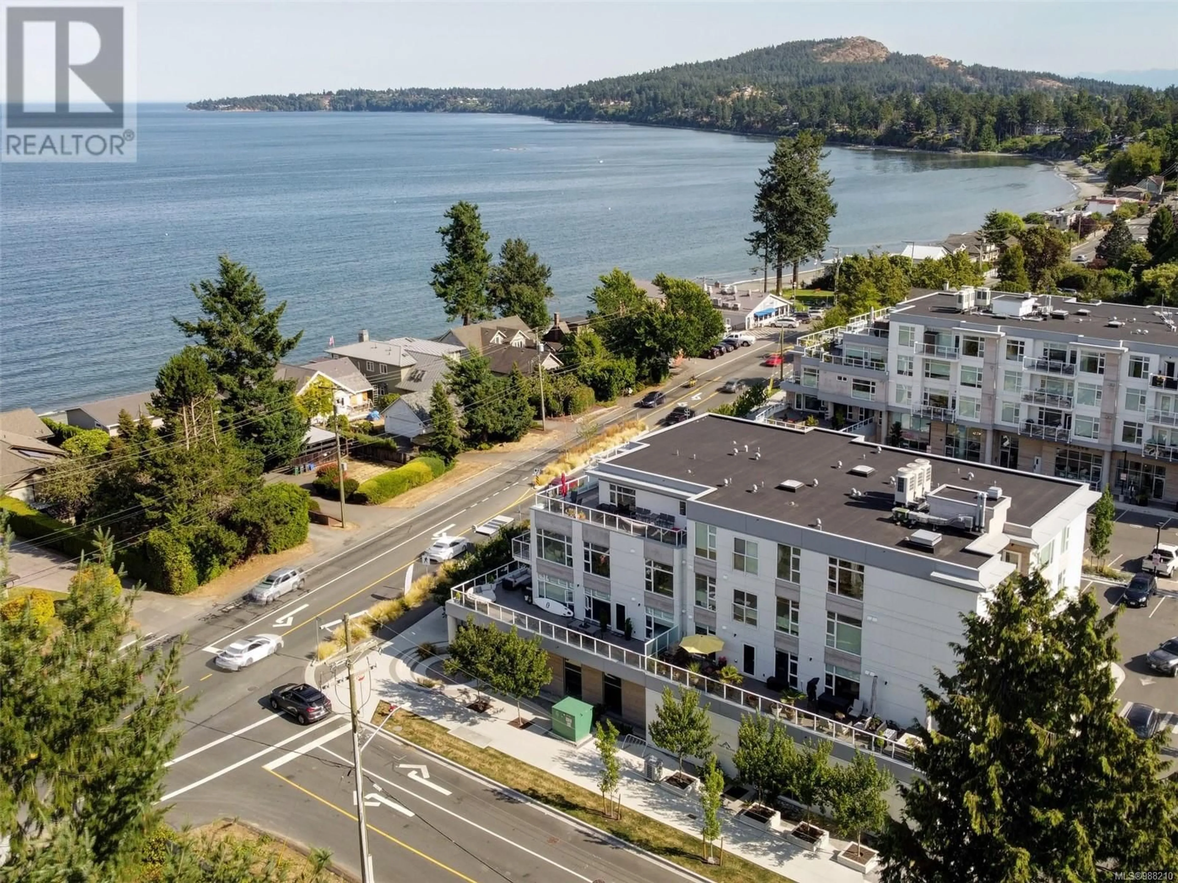 A pic from outside/outdoor area/front of a property/back of a property/a pic from drone, water/lake/river/ocean view for 205 - 5122 CORDOVA BAY ROAD, Saanich British Columbia V8Y2K5