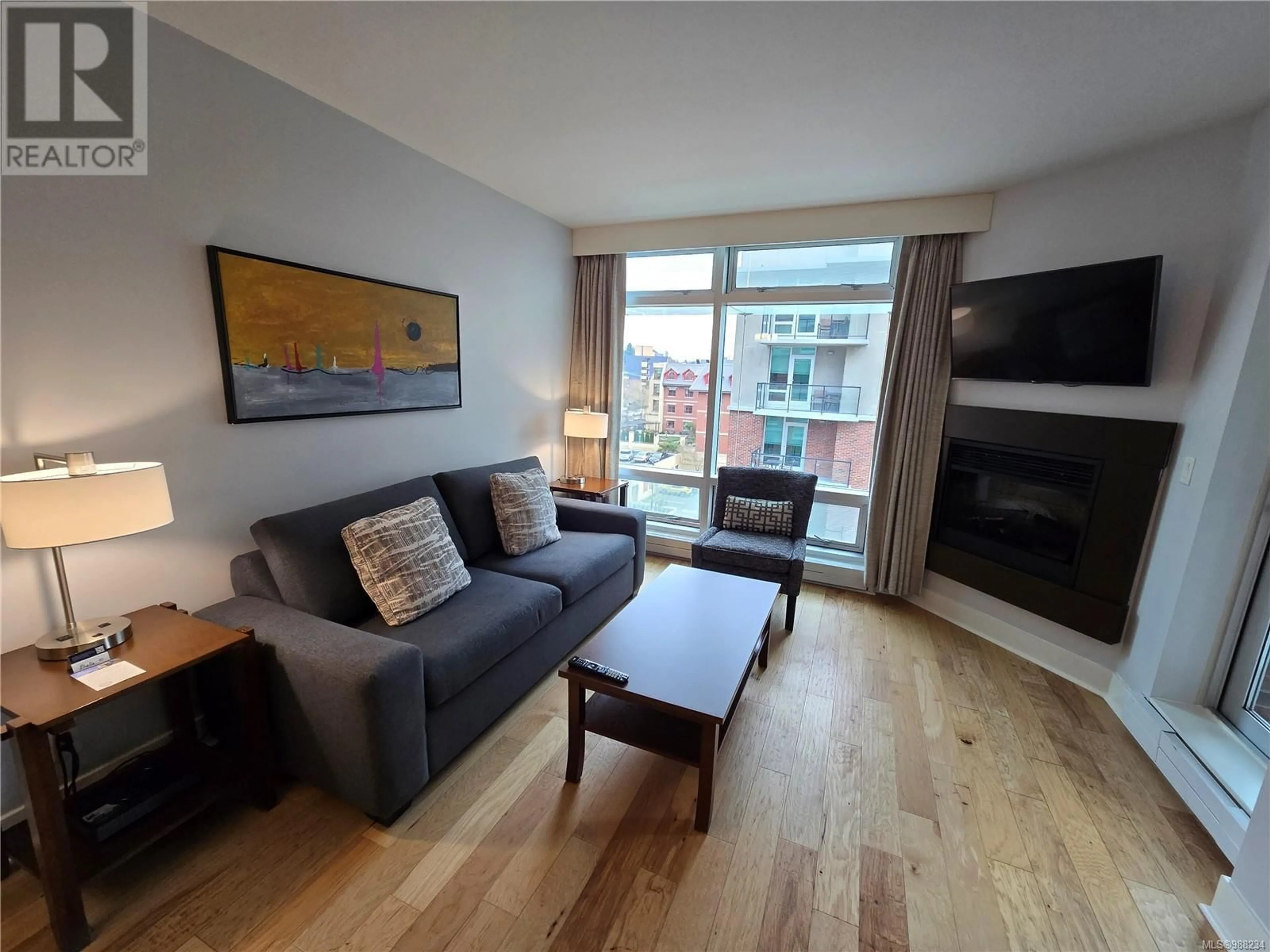 Living room with furniture, wood/laminate floor for A416 810 Humboldt St, Victoria British Columbia V8V5B1