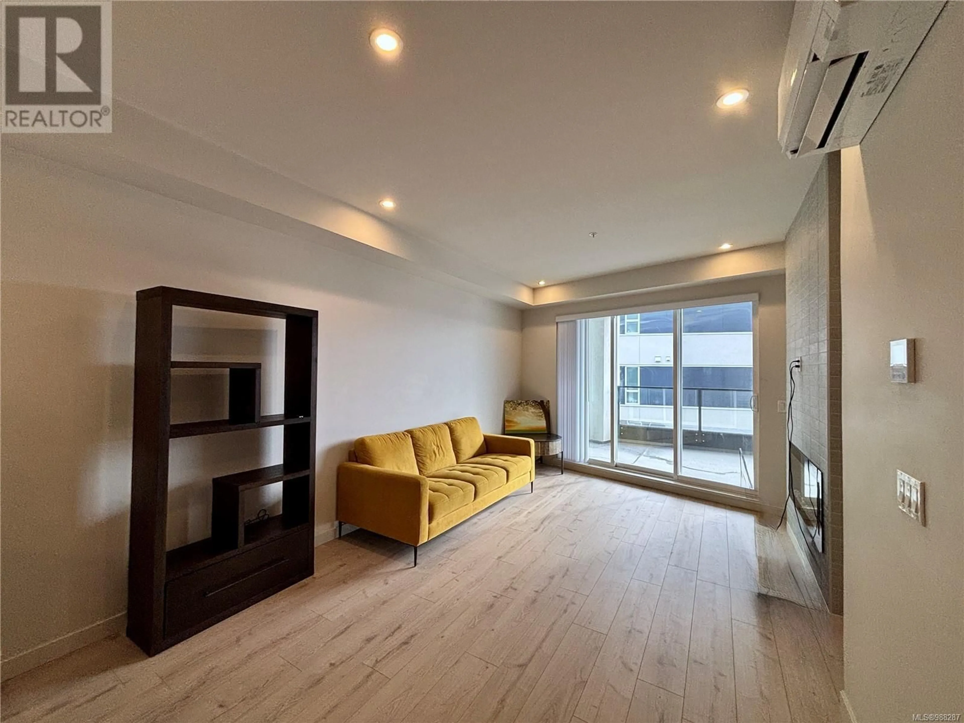 Living room with furniture, wood/laminate floor for 505 - 947 WHIRLAWAY CRESCENT, Langford British Columbia V9B6W6
