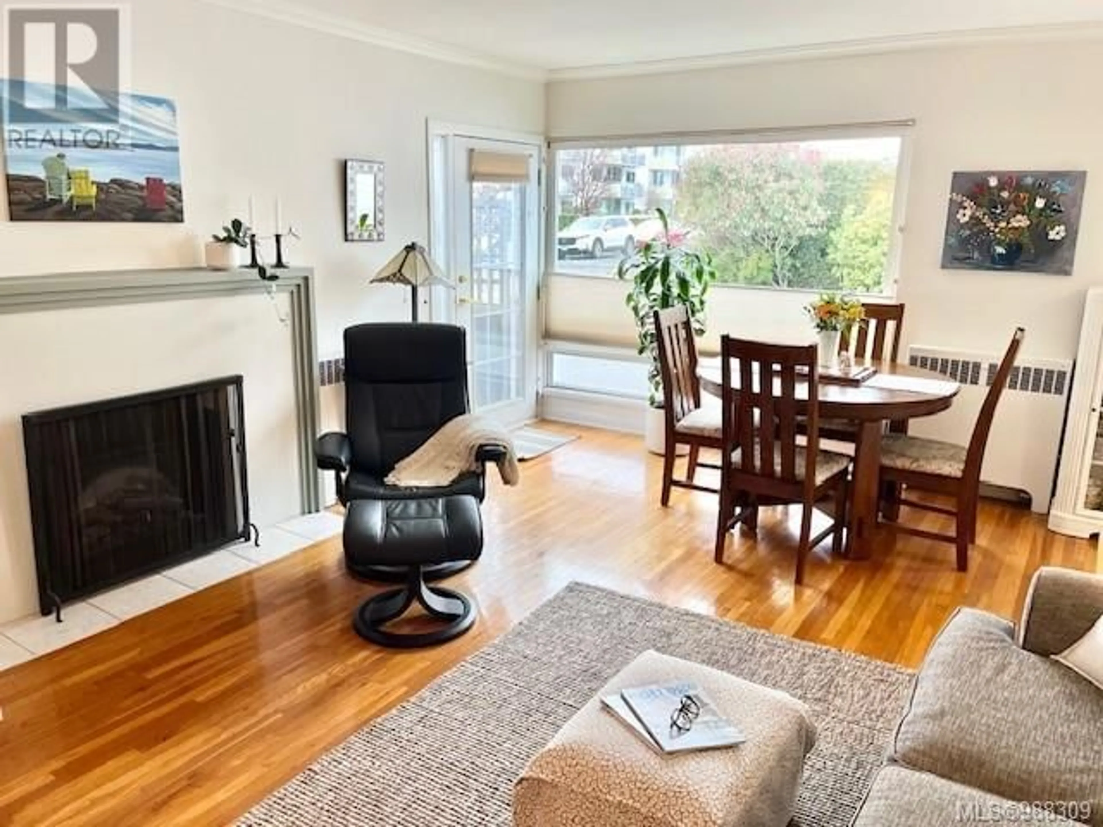 Living room with furniture, wood/laminate floor for 101 2660 Currie Rd, Oak Bay British Columbia V8S3C1