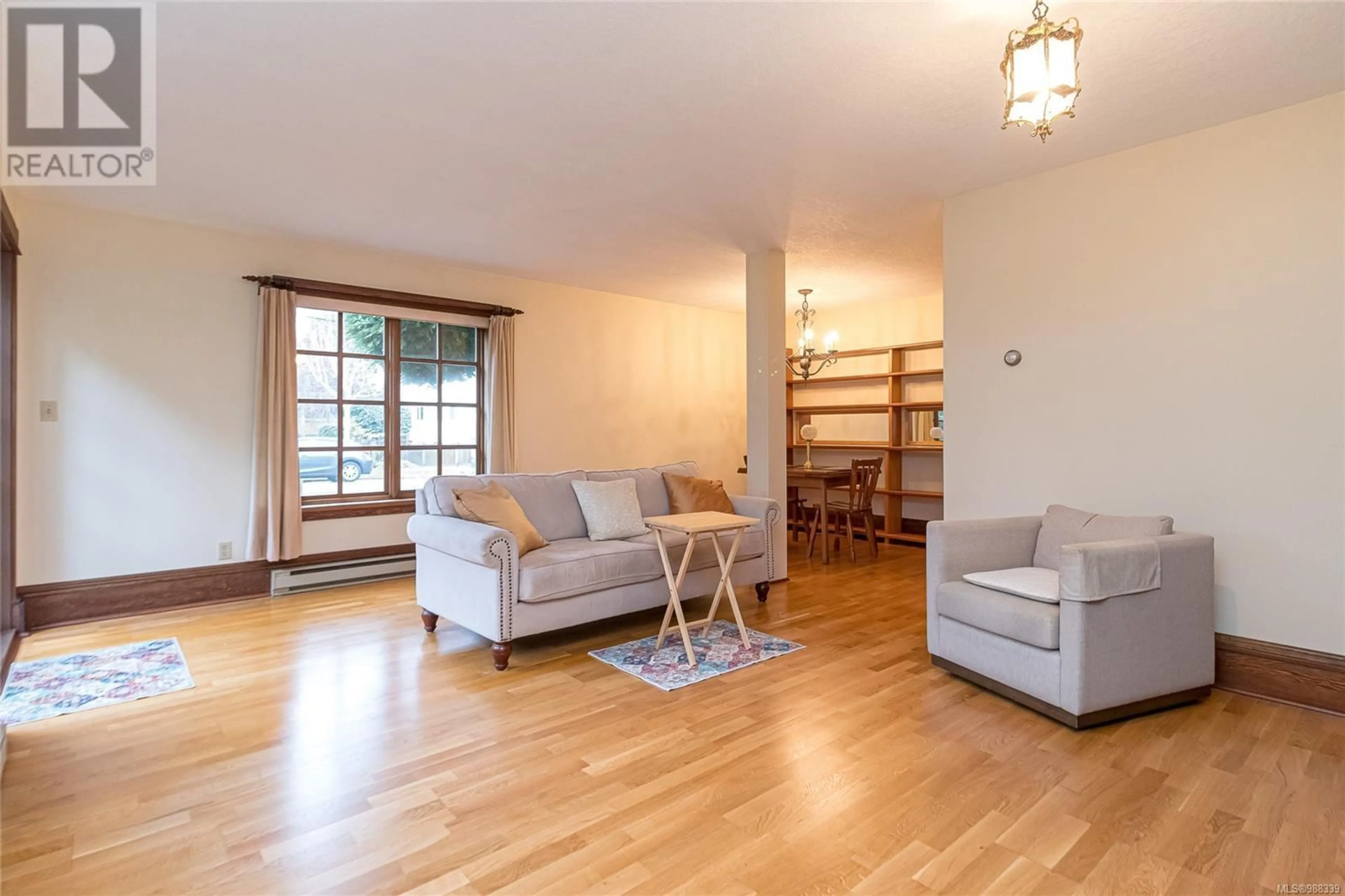 Living room with furniture, wood/laminate floor for 1144 Oscar St, Victoria British Columbia V8V2X4