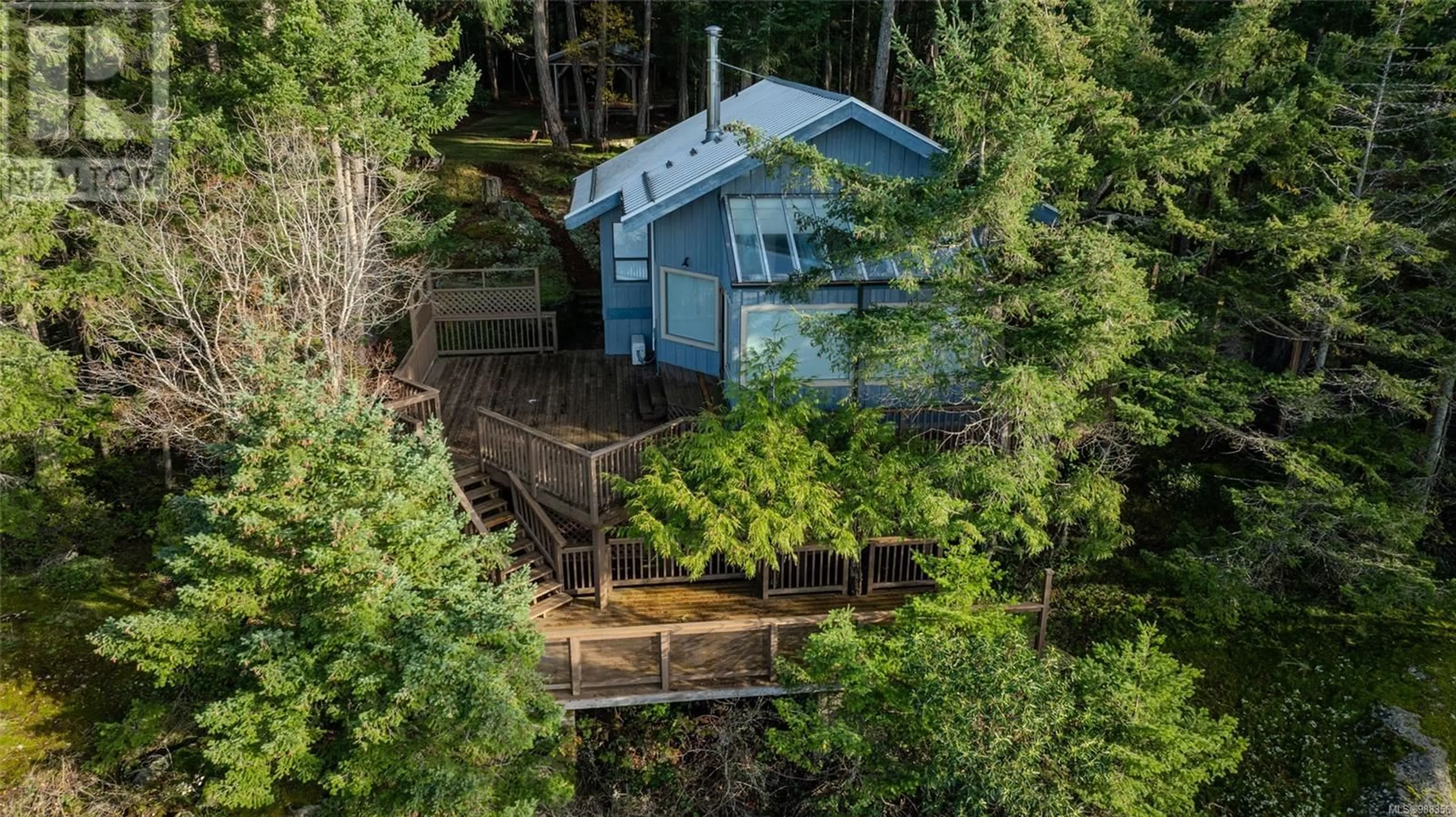 A pic from outside/outdoor area/front of a property/back of a property/a pic from drone, forest/trees view for 851 Canso Rd, Gabriola Island British Columbia V0R1X2