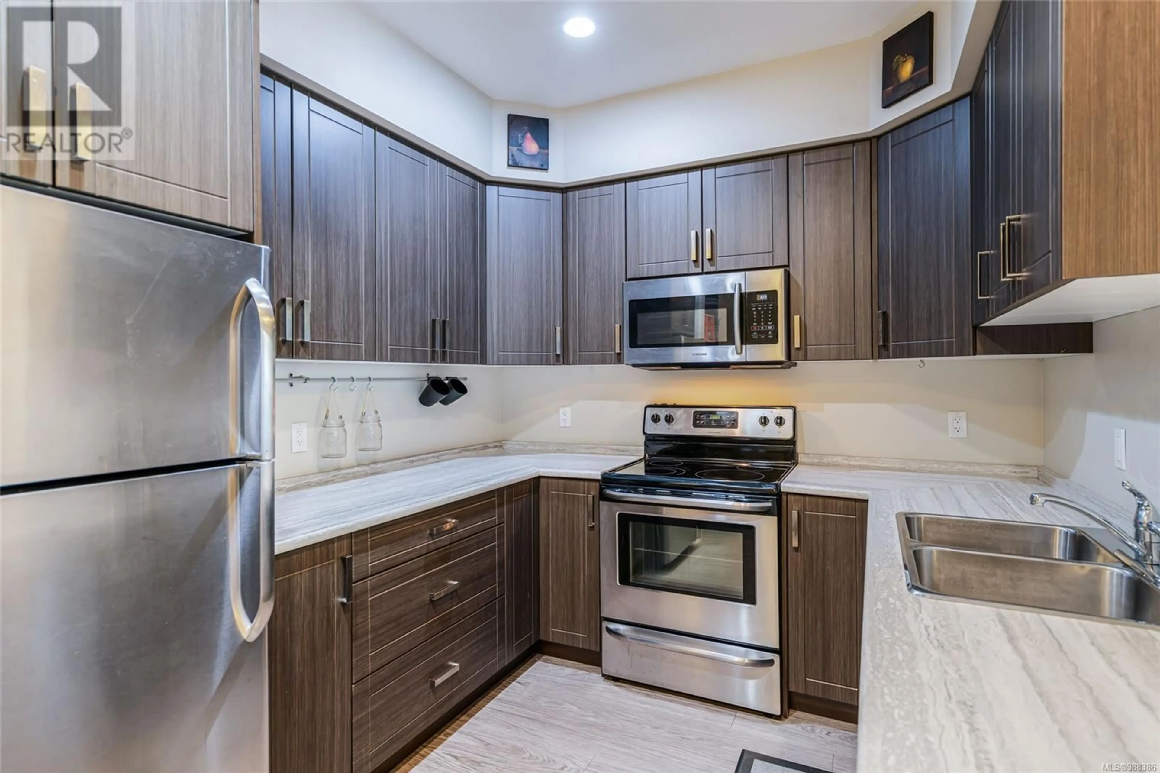 Standard kitchen, ceramic/tile floor for 105 4960 Songbird Pl, Nanaimo British Columbia V9T0H7