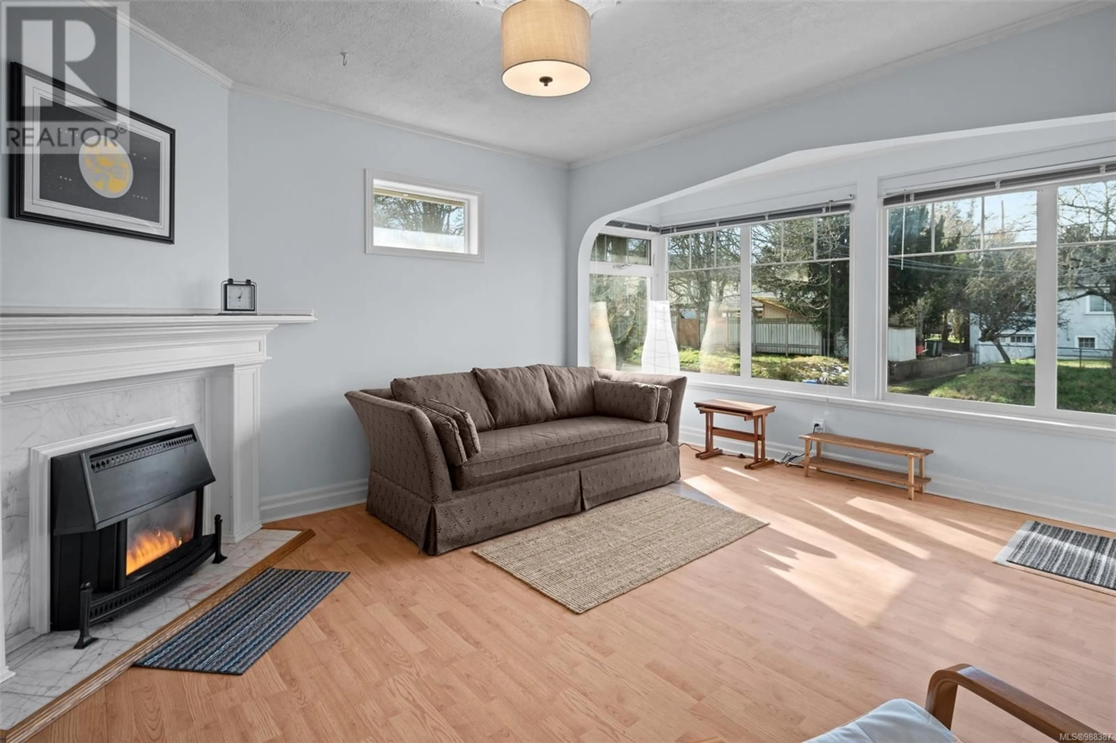 Living room with furniture, wood/laminate floor for 3139 Blackwood St, Victoria British Columbia V8X1C6