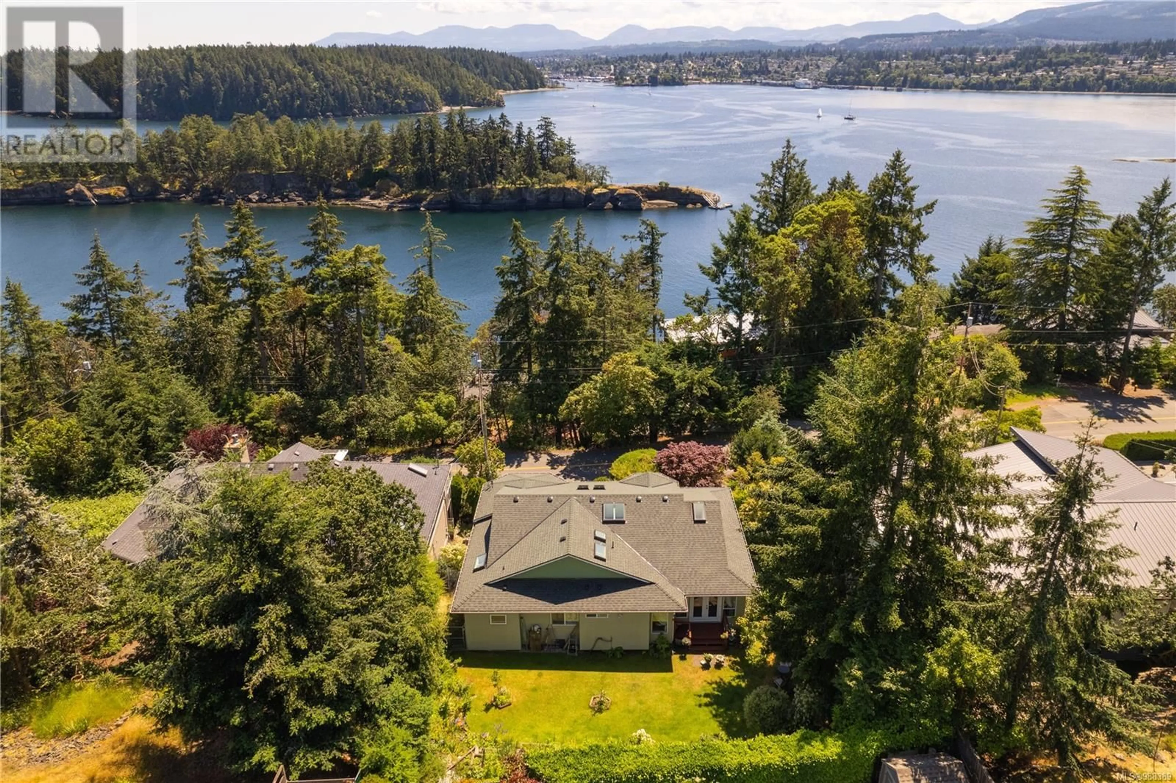 A pic from outside/outdoor area/front of a property/back of a property/a pic from drone, water/lake/river/ocean view for 3335 Stephenson Point Rd, Nanaimo British Columbia V9T1K3