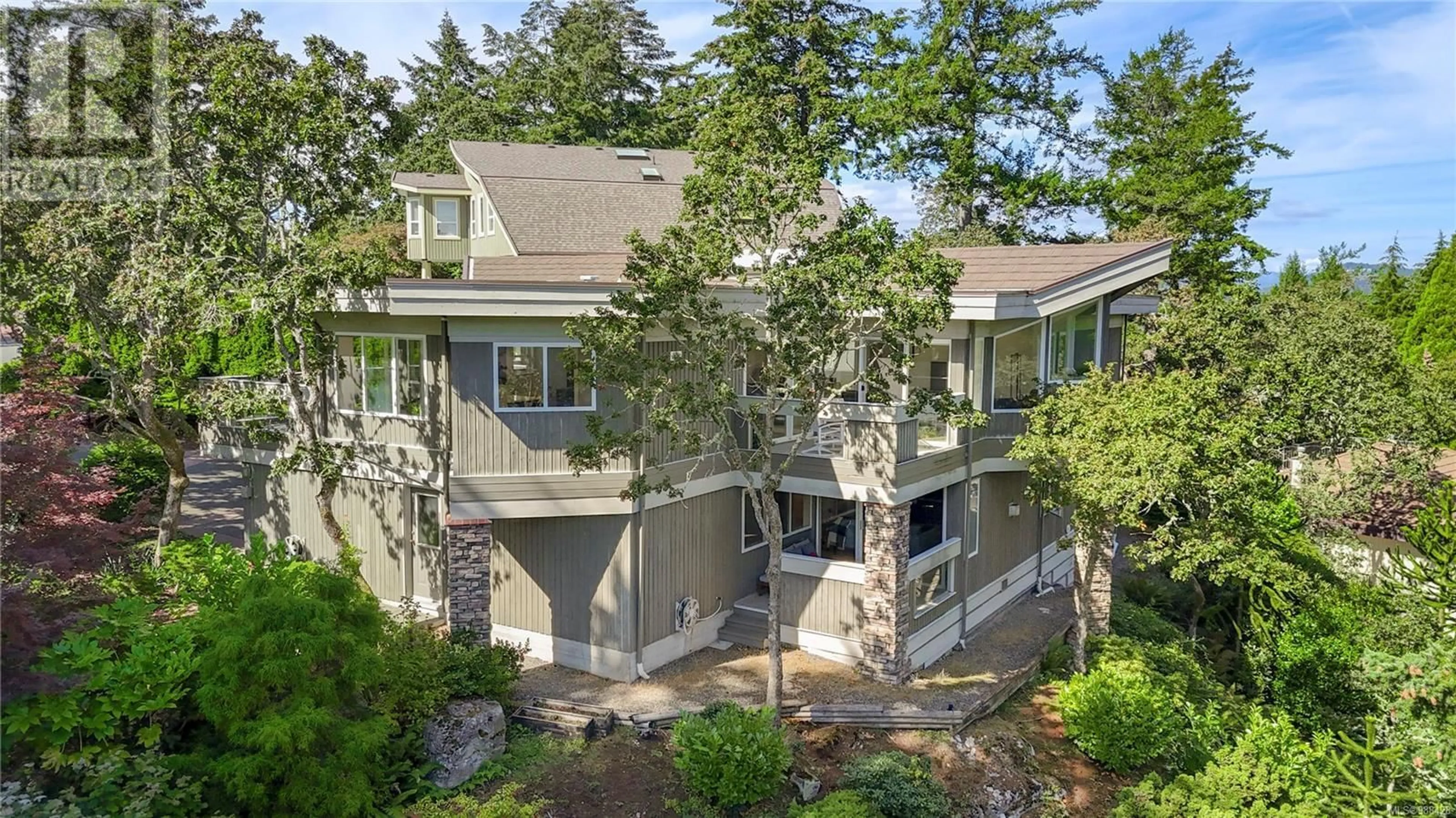 A pic from outside/outdoor area/front of a property/back of a property/a pic from drone, unknown for 4394 Wildflower Lane, Saanich British Columbia V8X5H1