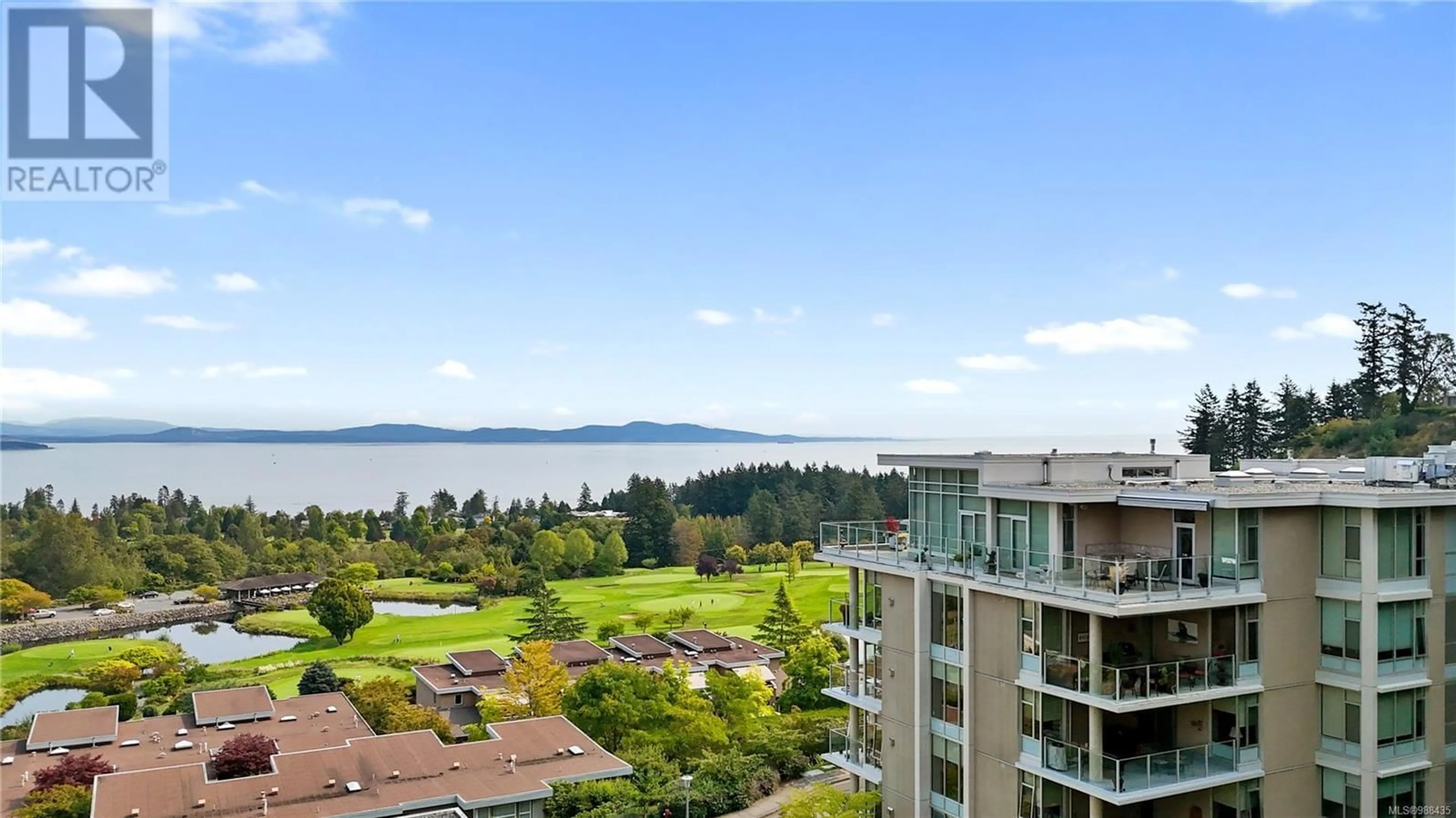 A pic from outside/outdoor area/front of a property/back of a property/a pic from drone, water/lake/river/ocean view for 402 748 Sayward Hill Terr, Saanich British Columbia V8Y3K1