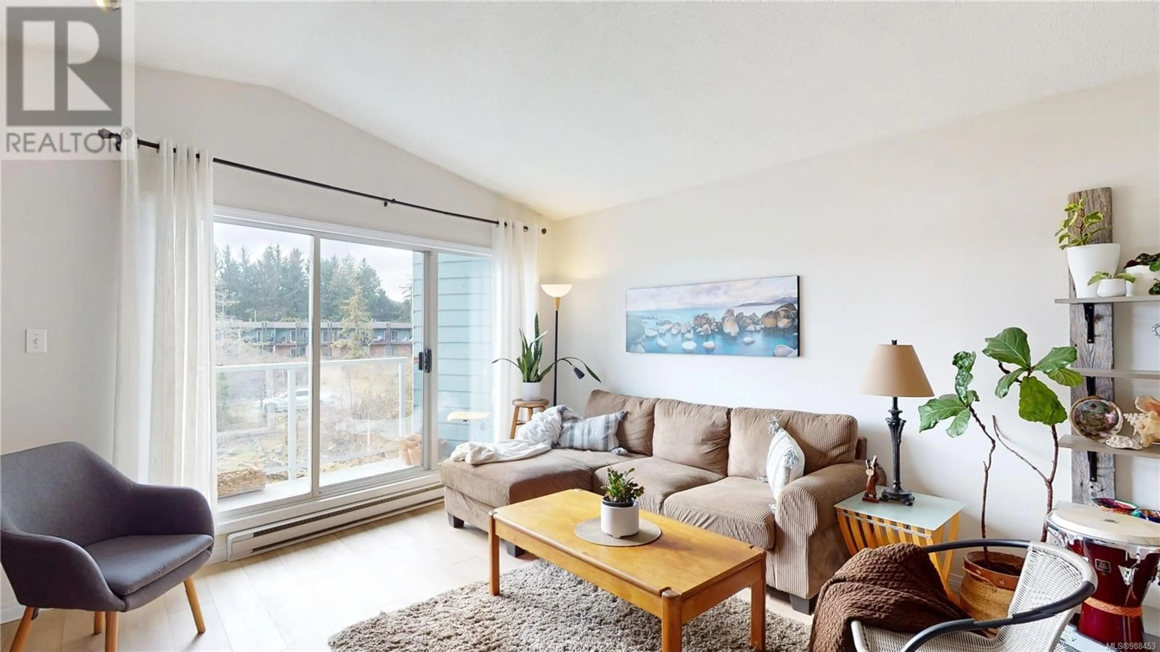 Living room with furniture, wood/laminate floor for 11 6110 Seabroom Rd, Sooke British Columbia V9Z0B8