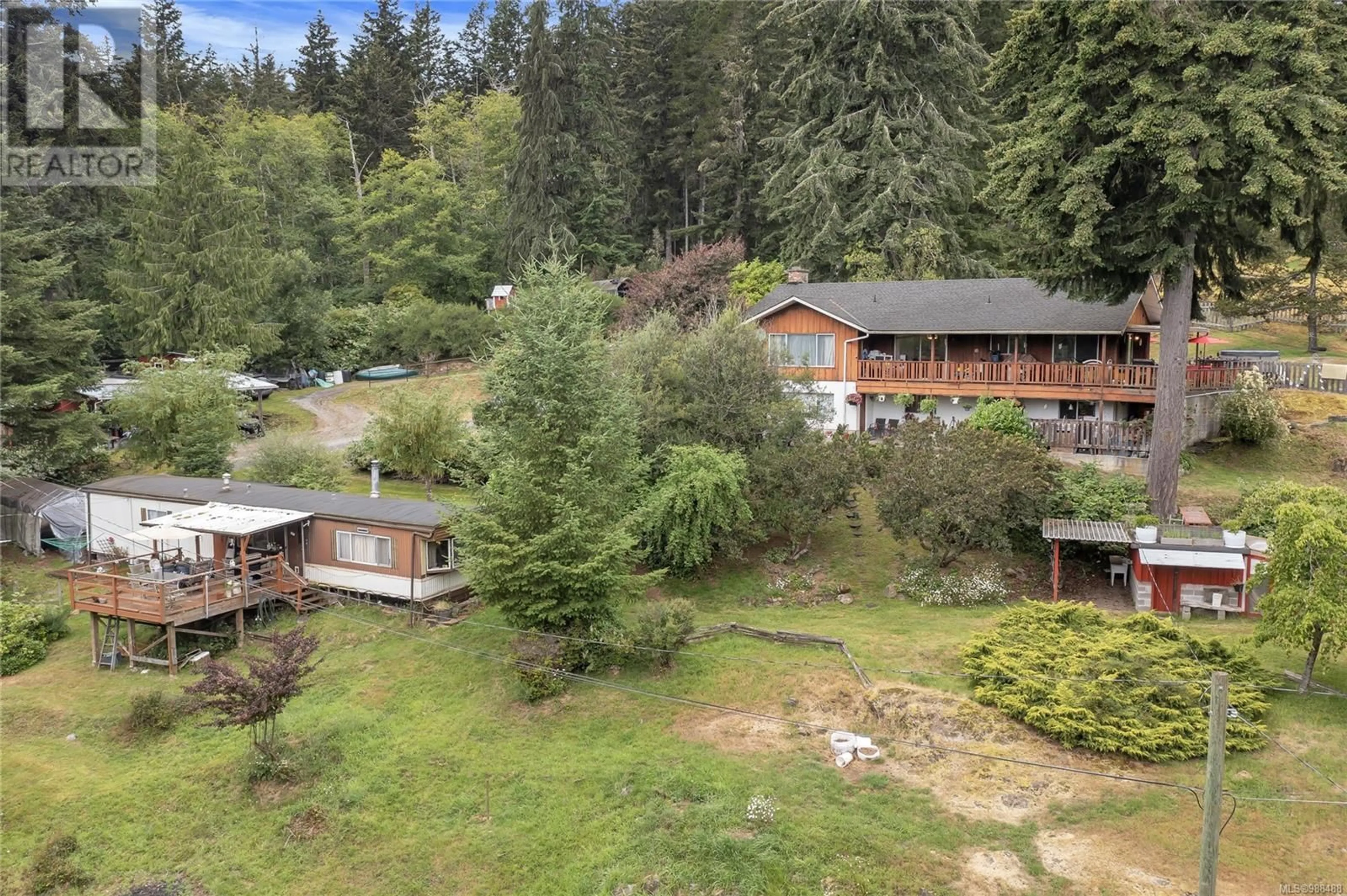 A pic from outside/outdoor area/front of a property/back of a property/a pic from drone, forest/trees view for 3765 Otter Point Rd, Sooke British Columbia V9Z0K1