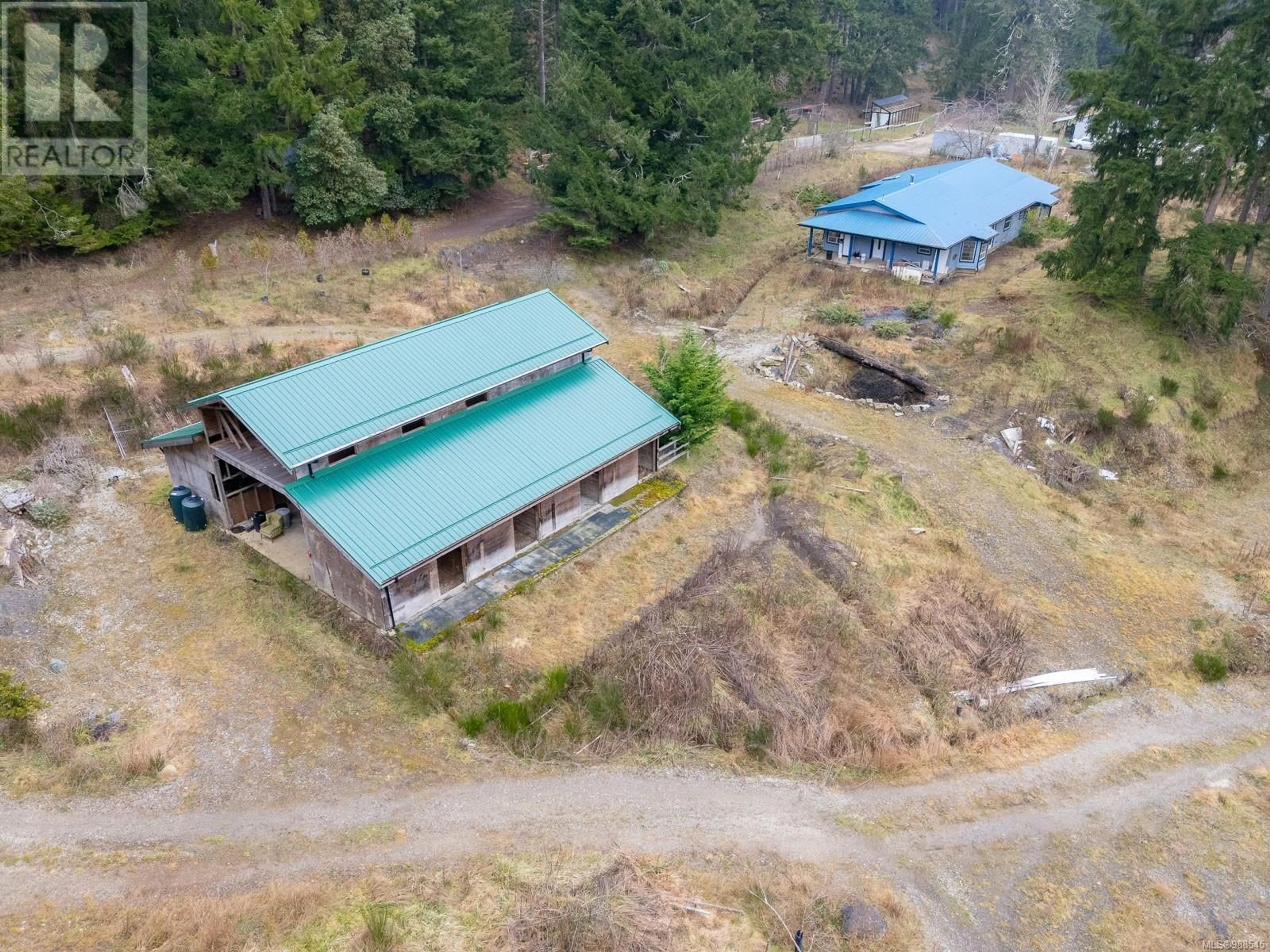 A pic from outside/outdoor area/front of a property/back of a property/a pic from drone, building for 328 Blackburn Rd, Salt Spring British Columbia V8K2B8