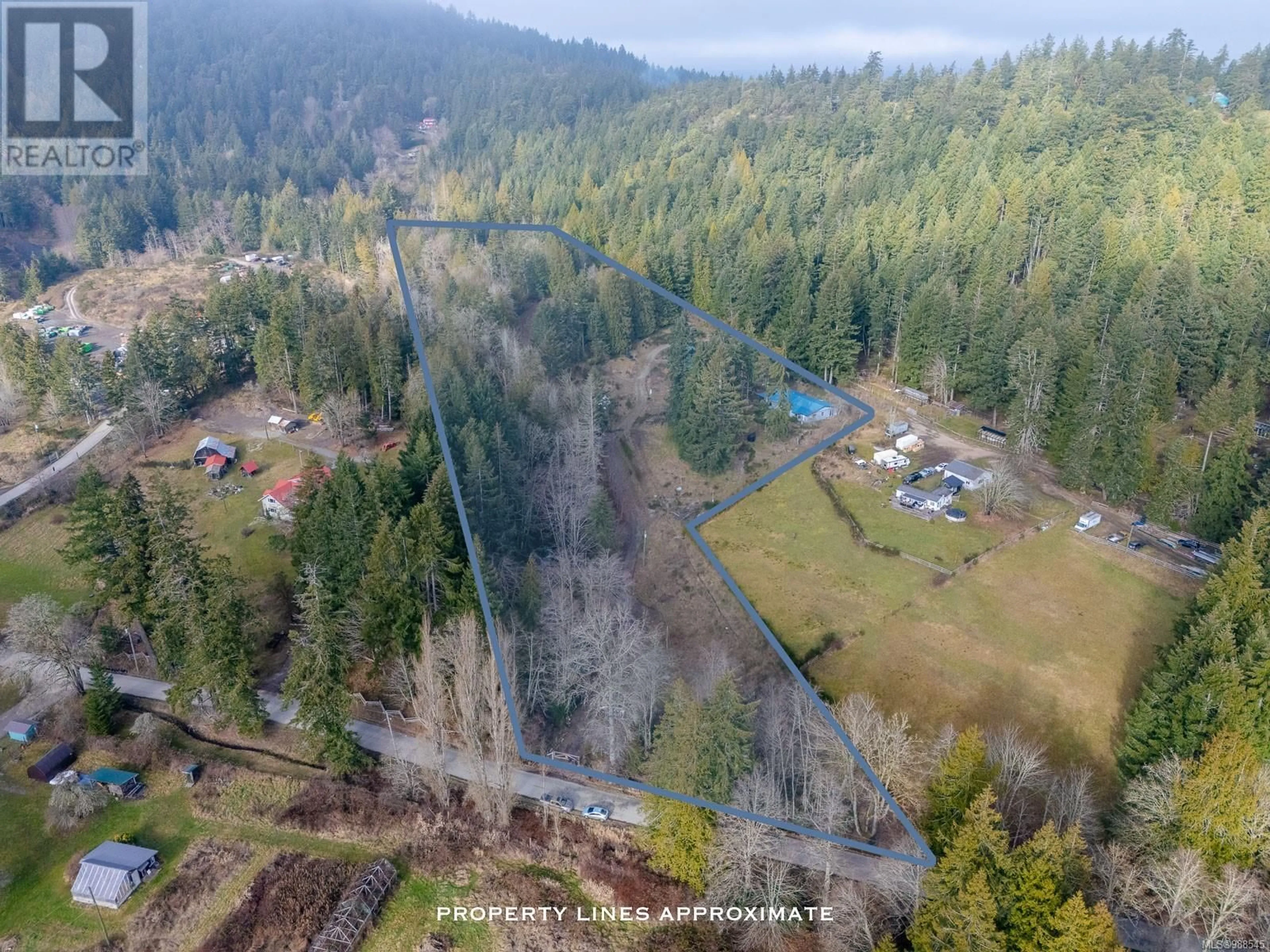 A pic from outside/outdoor area/front of a property/back of a property/a pic from drone, forest/trees view for 328 Blackburn Rd, Salt Spring British Columbia V8K2B8