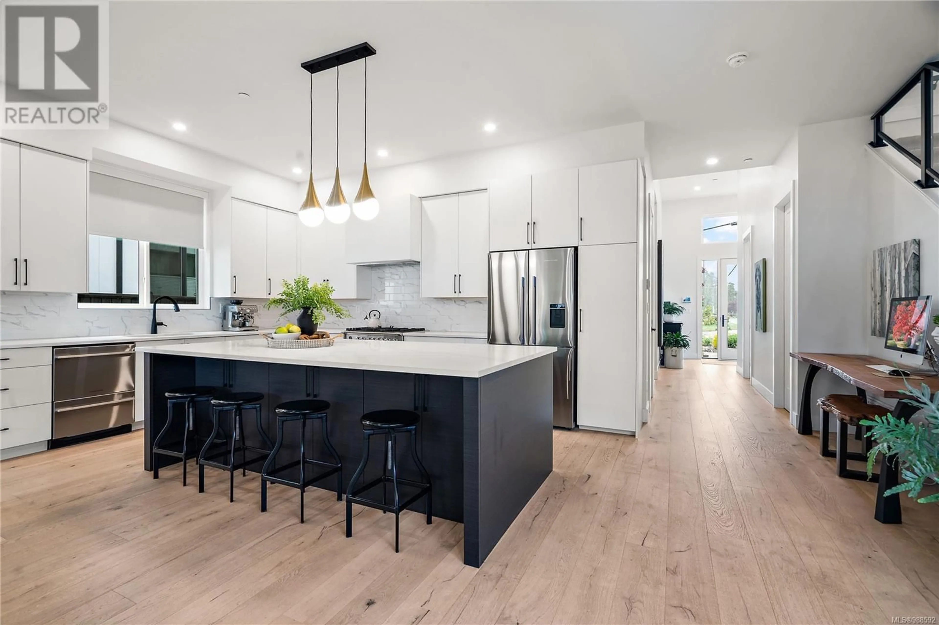 Open concept kitchen, wood/laminate floor for 9499 MARYLAND DRIVE, Sidney British Columbia V8L2R7