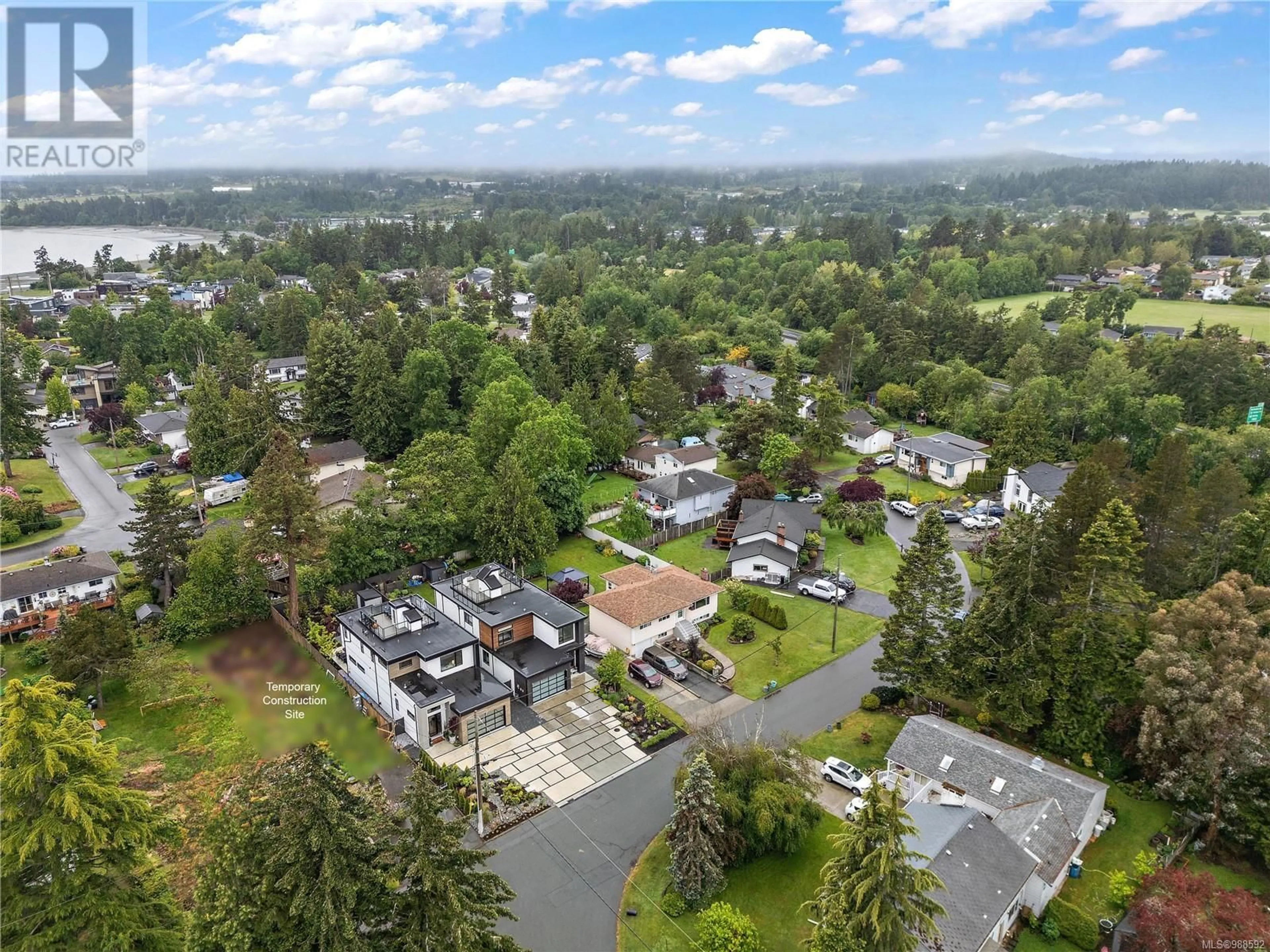 A pic from outside/outdoor area/front of a property/back of a property/a pic from drone, mountain view for 9499 Maryland Dr, Sidney British Columbia V8L2R7