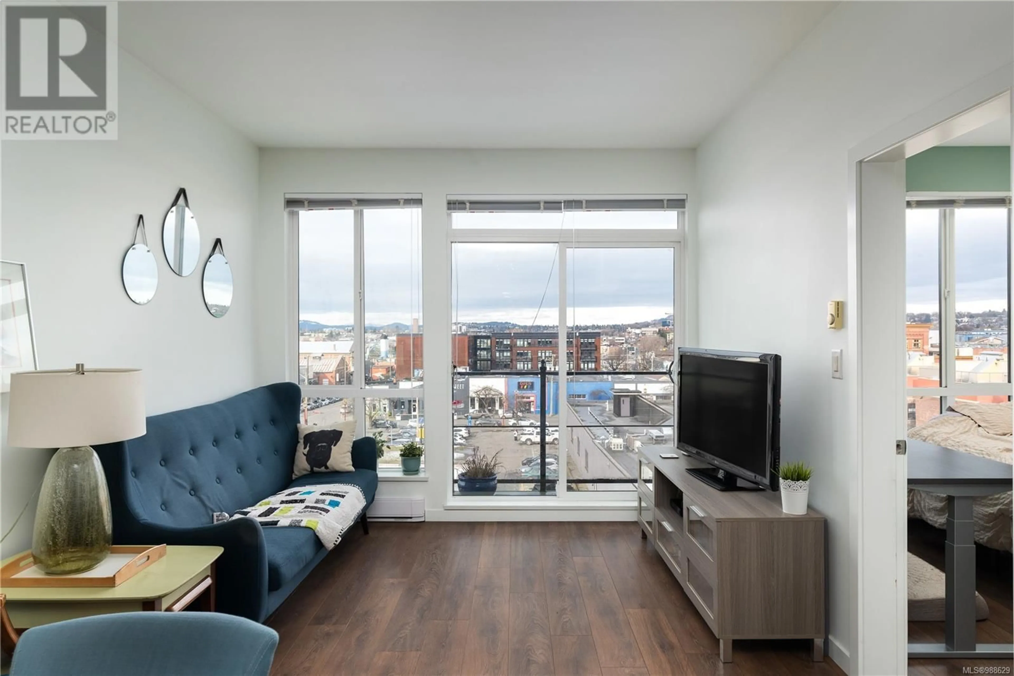 Living room with furniture, wood/laminate floor for 508 517 Fisgard St, Victoria British Columbia V8W0C5