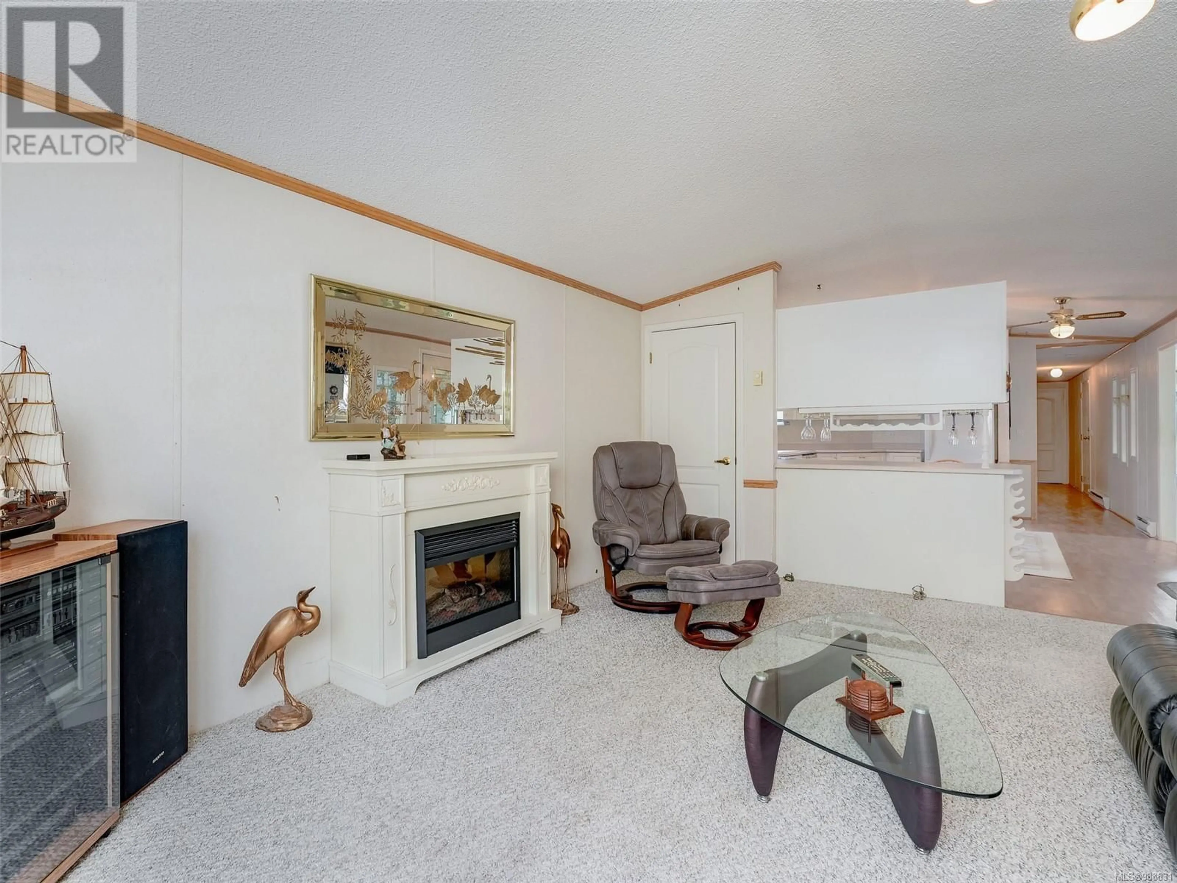 Living room with furniture, ceramic/tile floor for 30 7401 Central Saanich Rd, Central Saanich British Columbia V8M2B5