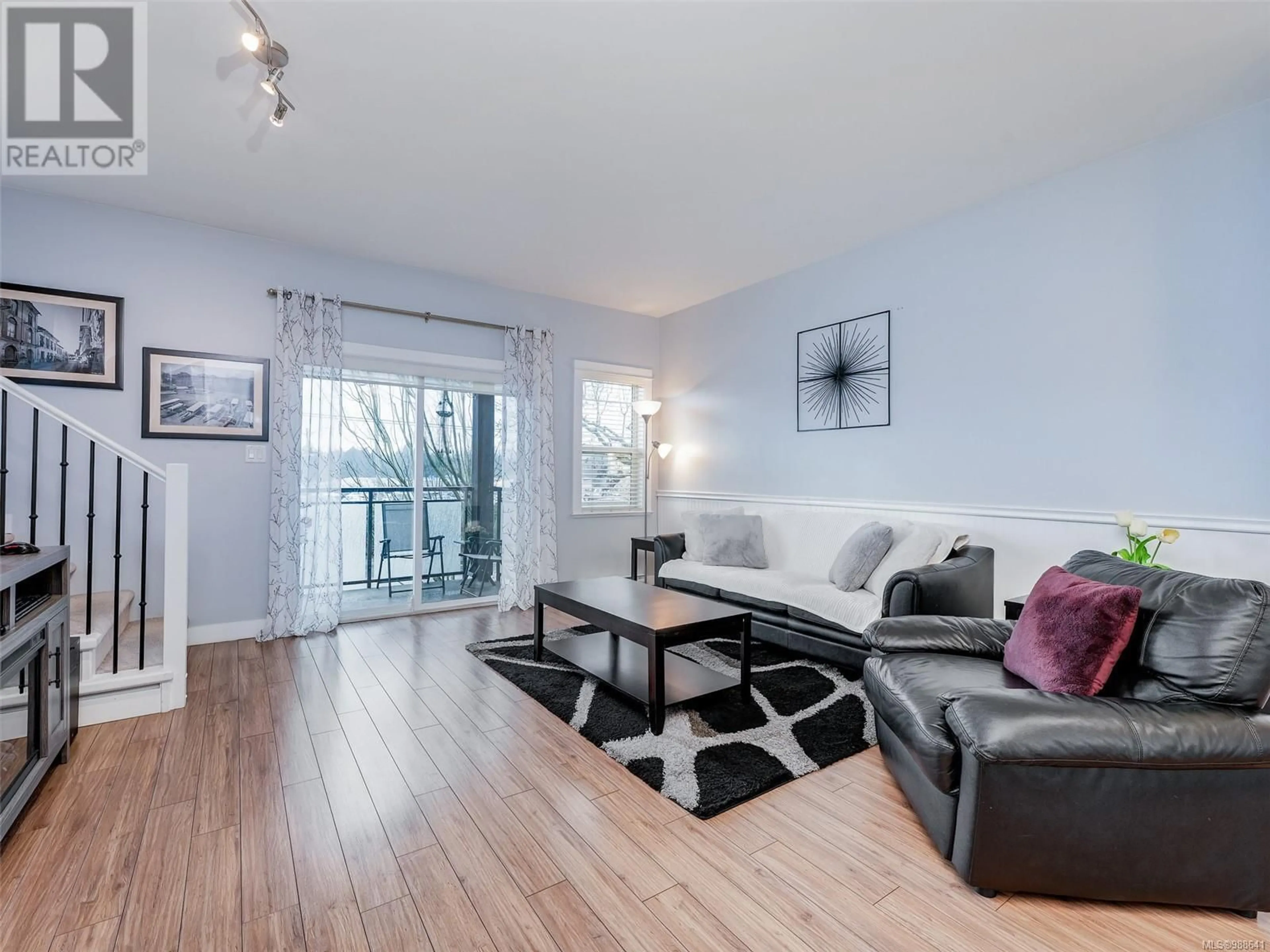 Living room with furniture, wood/laminate floor for 990 Dunford Ave, Langford British Columbia V9B2S3