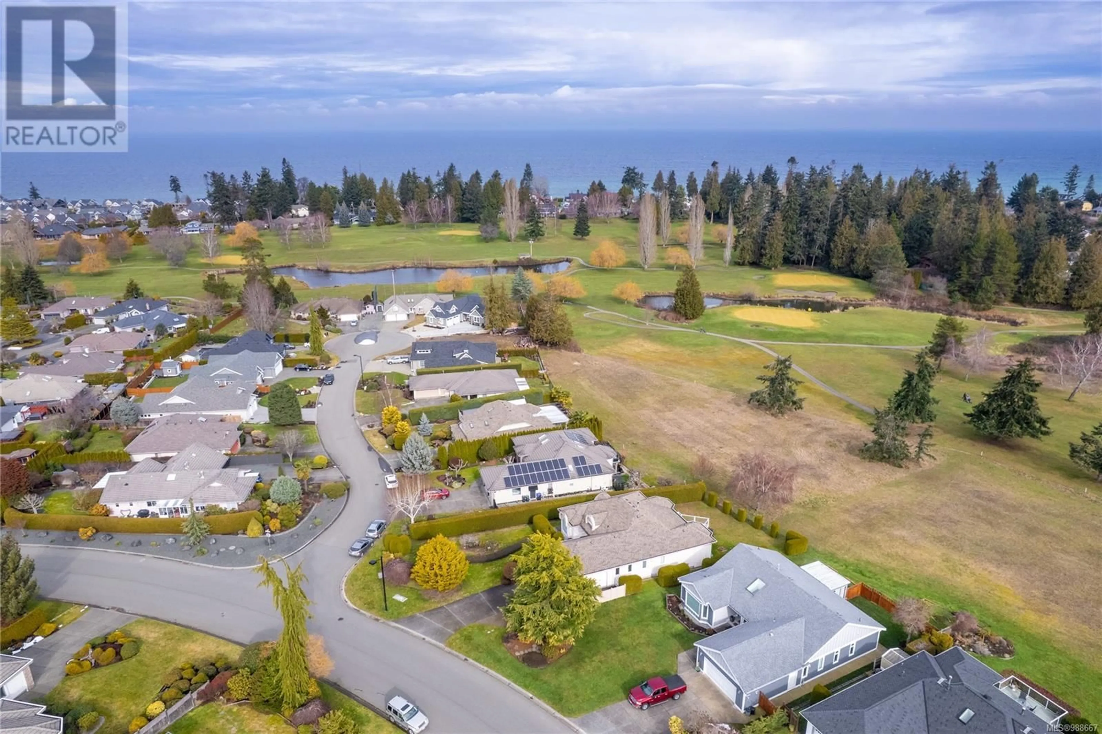 A pic from outside/outdoor area/front of a property/back of a property/a pic from drone, water/lake/river/ocean view for 951 Royal Dornoch Dr, Qualicum Beach British Columbia V9K1E1