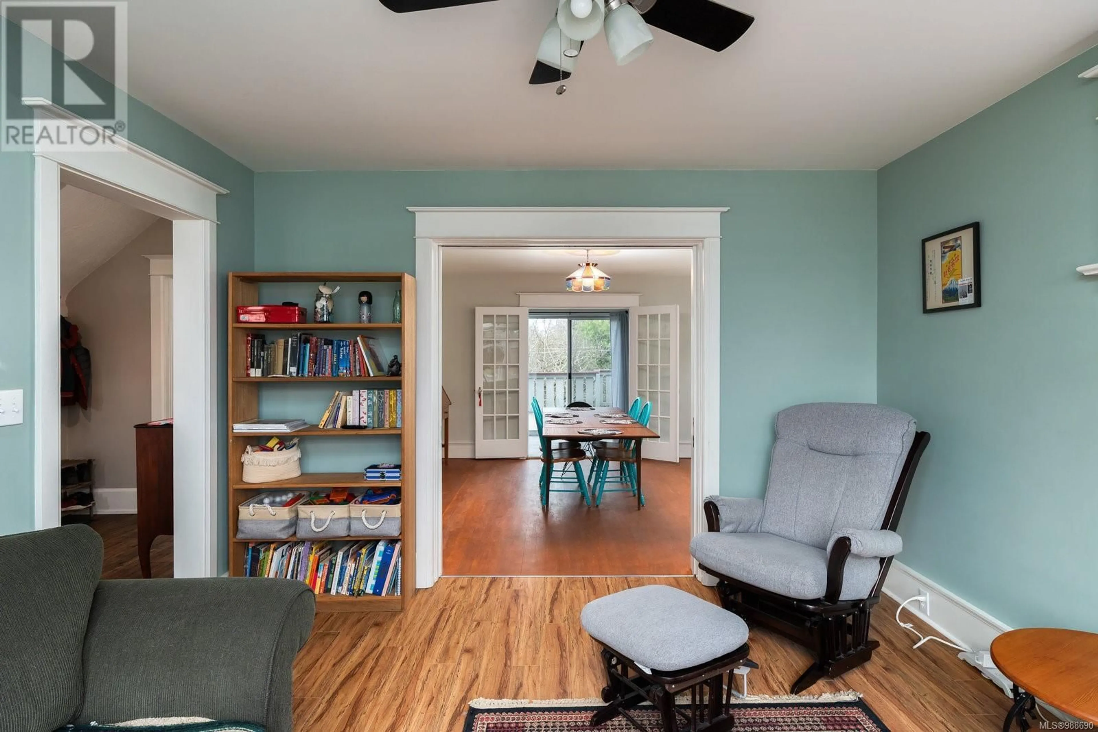 Living room with furniture, wood/laminate floor for 2715 Mt. Stephen Ave, Victoria British Columbia V8T3L7