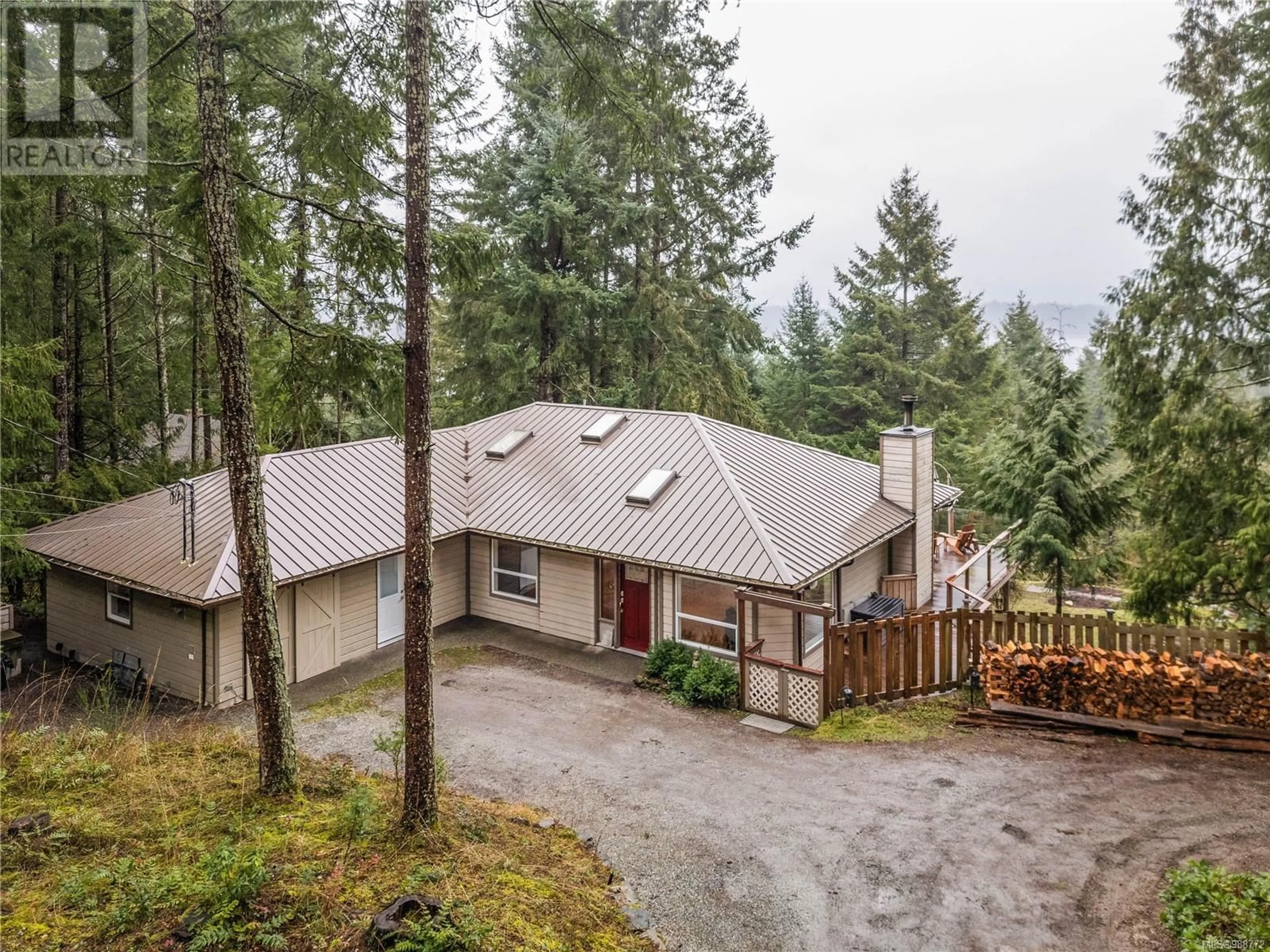 A pic from outside/outdoor area/front of a property/back of a property/a pic from drone, forest/trees view for 2265 North End Rd, Salt Spring British Columbia V8K1A7