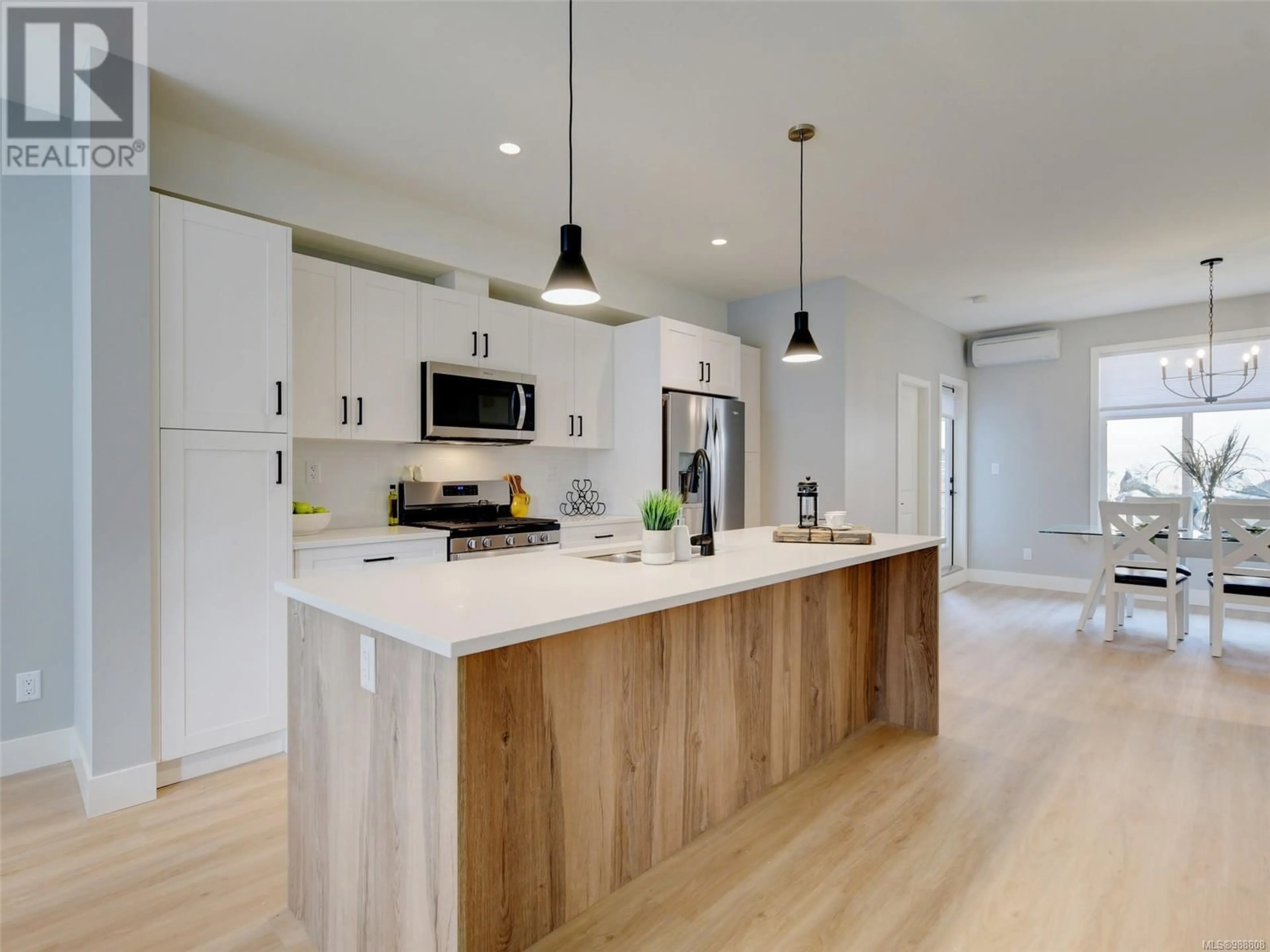 Open concept kitchen, wood/laminate floor for 113 2120 Triangle Trail, Langford British Columbia V9C0R2