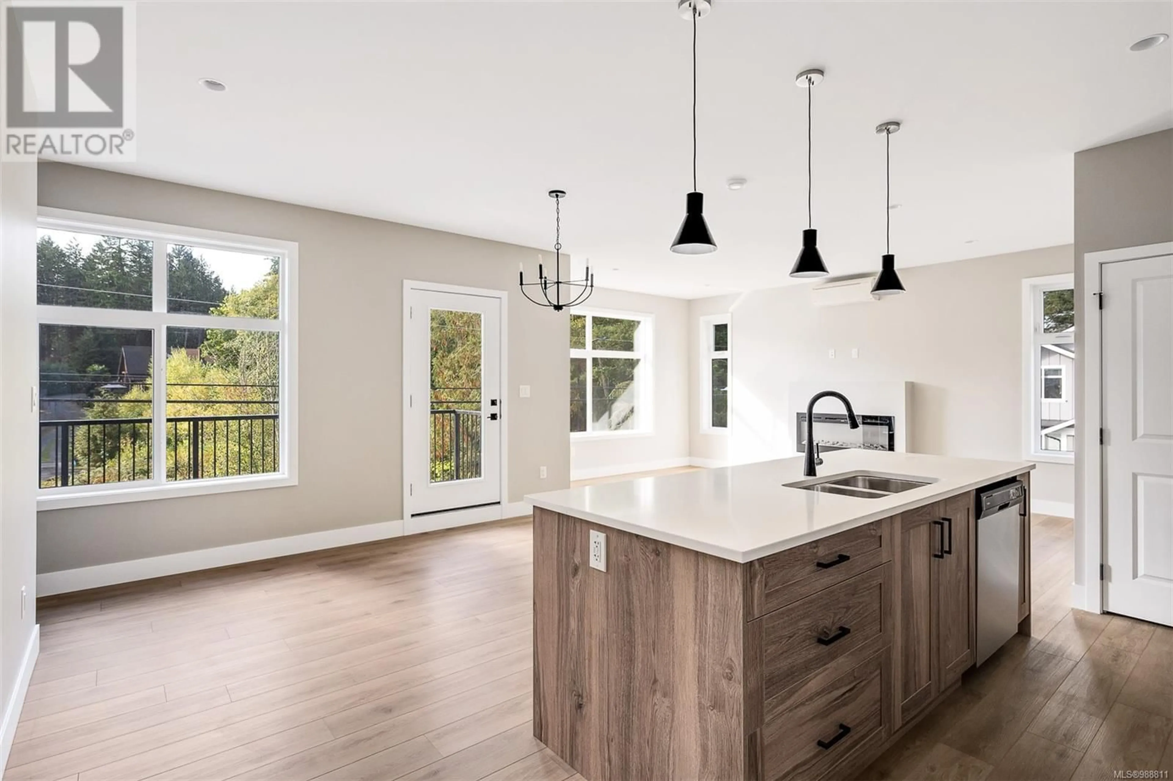 Open concept kitchen, wood/laminate floor for 102 2110 Triangle Trail, Langford British Columbia V9C0R2